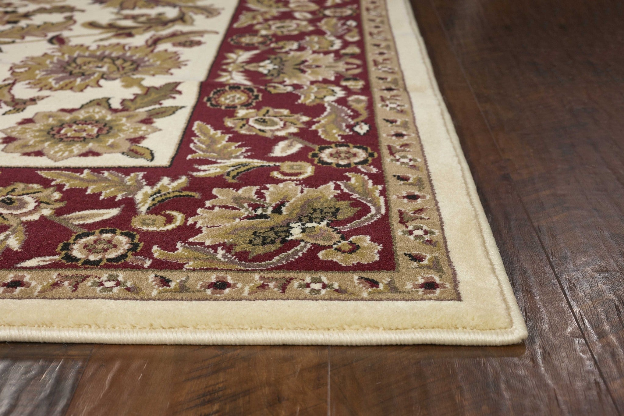 A beautiful 9x13 inches Polypropylene area rug in ivory and red, showcasing intricate patterns and a luxurious texture, perfect for enhancing home decor.