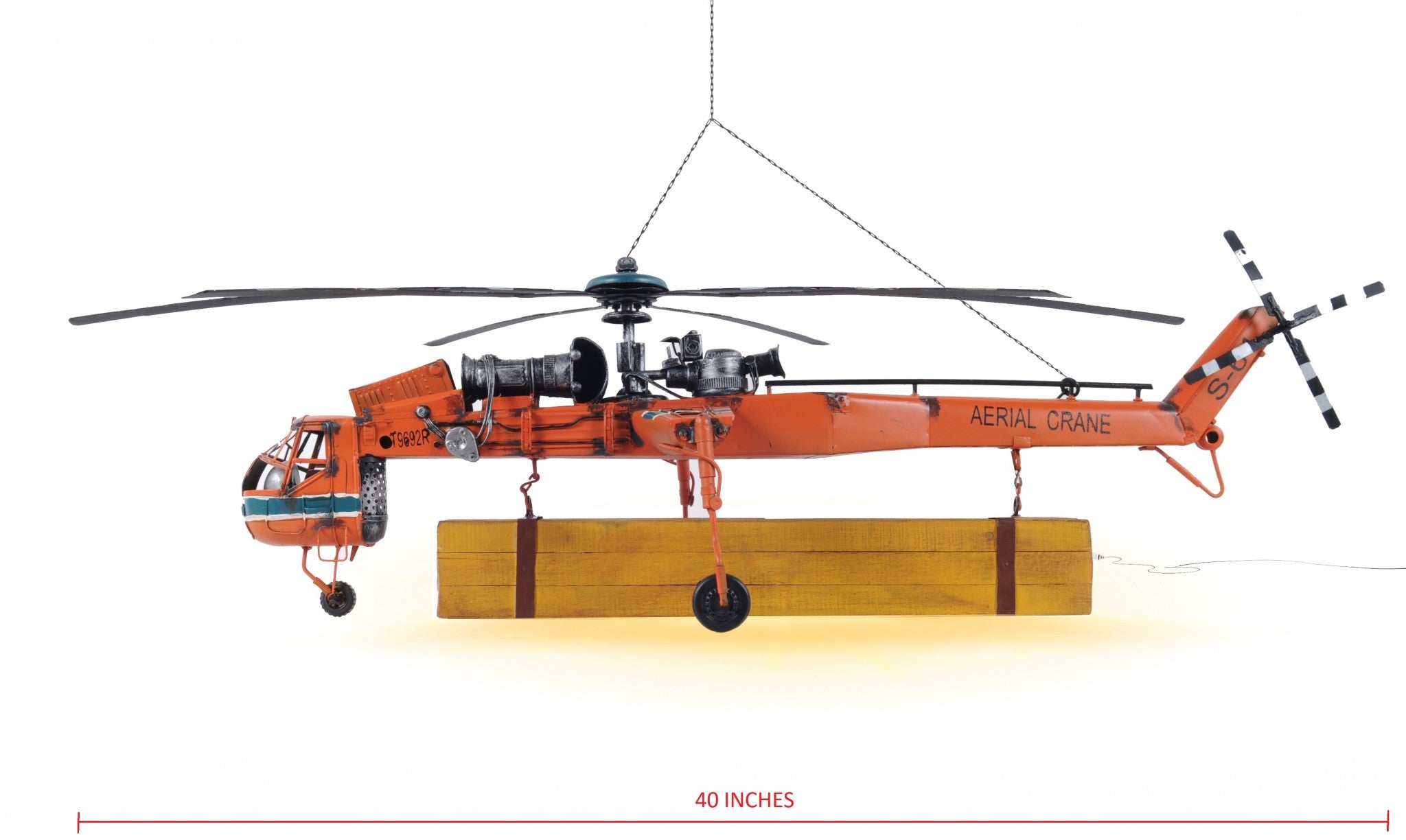 Aerial Crane Lifting Helicopter LED Sculpture showcasing intricate details and vibrant orange color, suspended with cargo and illuminated by LED lights.