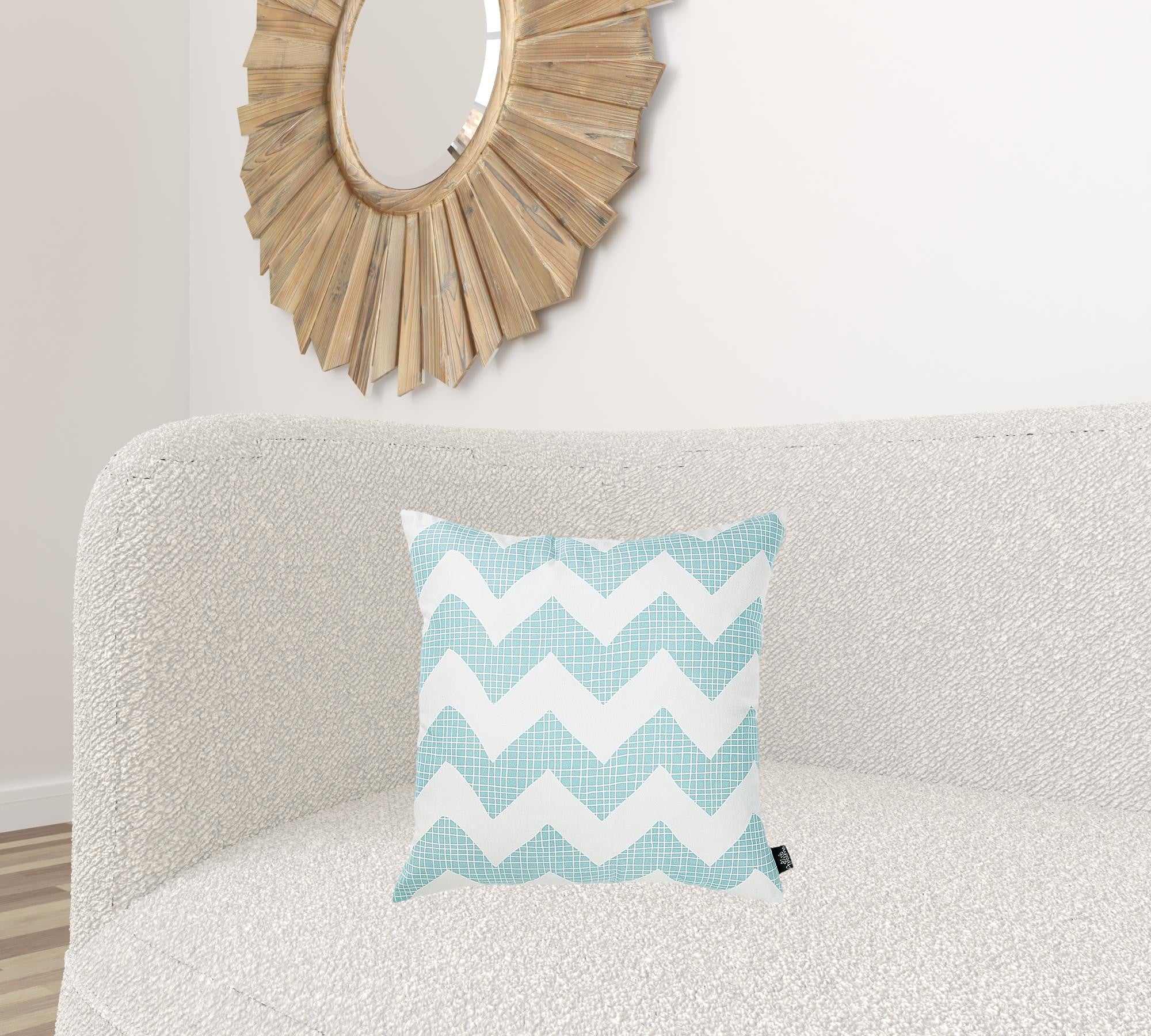 Aqua blue chevron printed decorative throw pillow cover with a hidden zipper, showcasing a vibrant pattern on the front and solid white back.