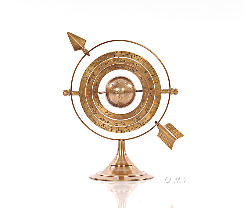 Armillary brass sculpture with bright annealed finish, featuring zodiac signs and symbols, showcasing celestial movements around Earth.