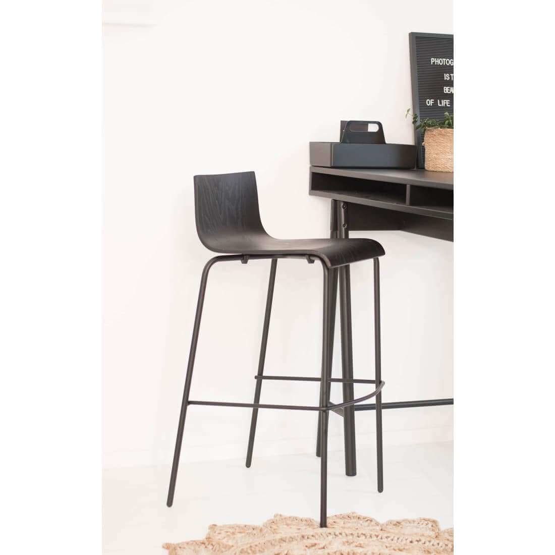 Barstool Pure Oak Black showcasing its elegant oak wood design and comfortable footrest, perfect for kitchen or bar use.