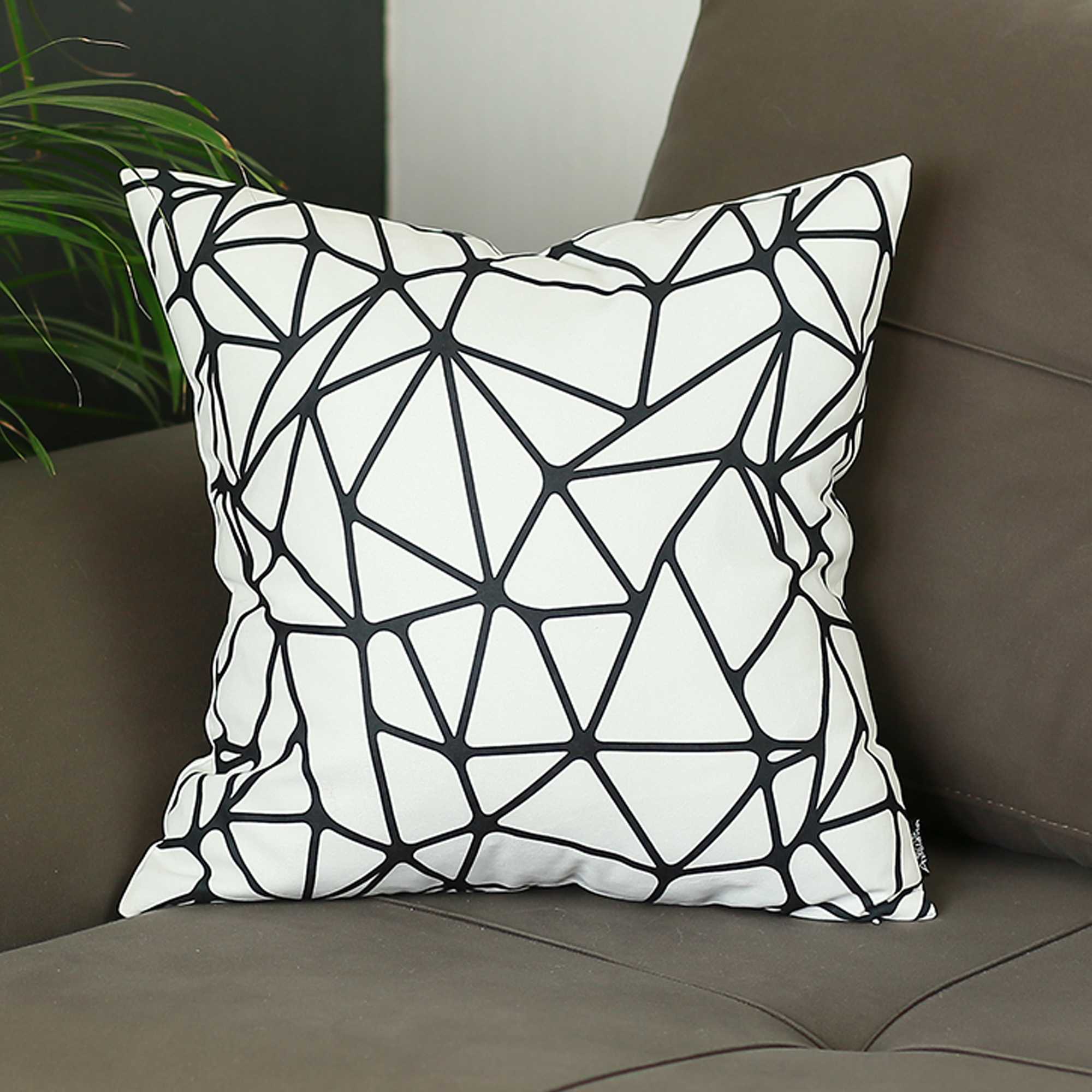 Black and white abstract geometric decorative throw pillow cover with hidden zipper and solid white back.