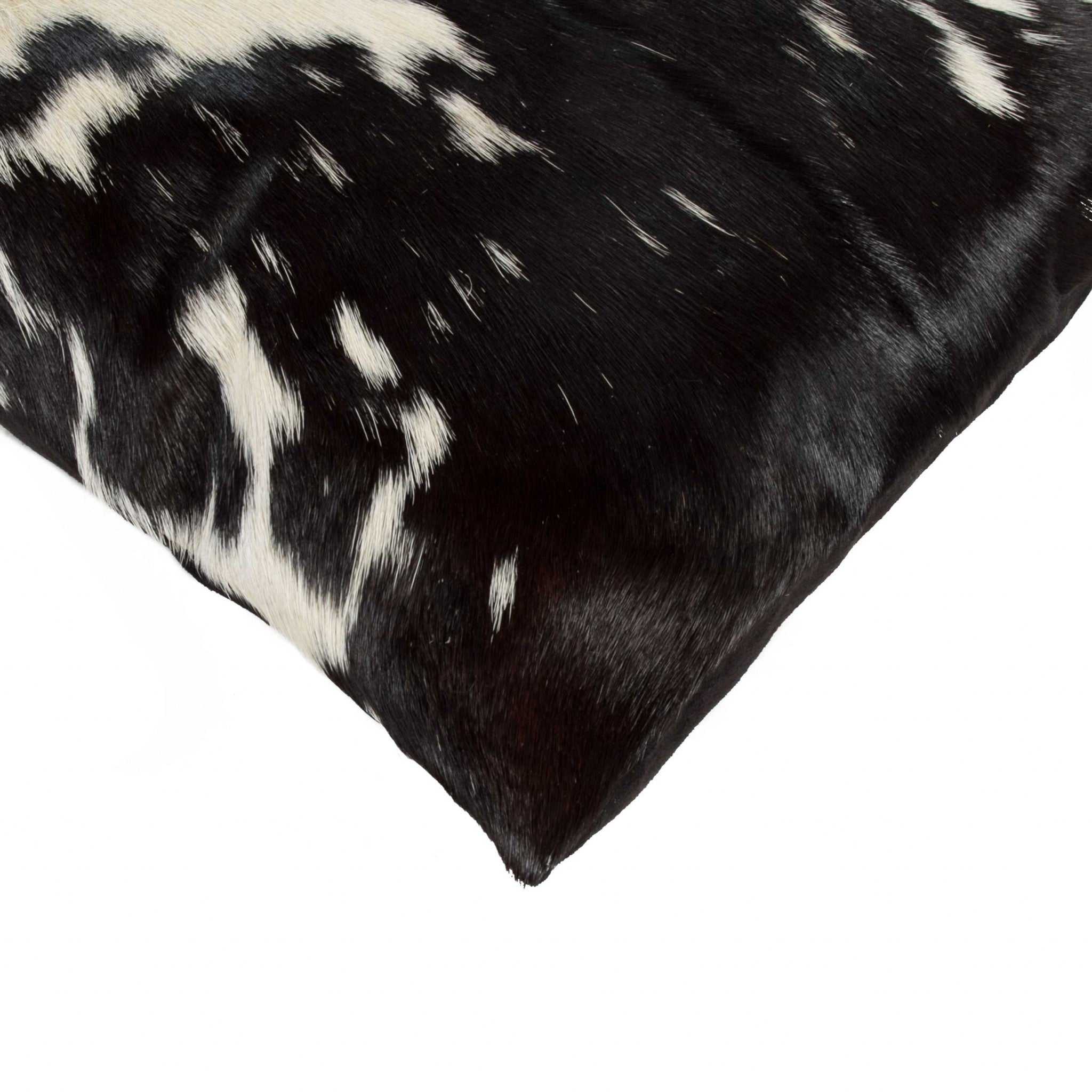 Black and White Torino Kobe Cowhide Pillow showcasing unique mottling and luxurious texture, perfect for modern decor.