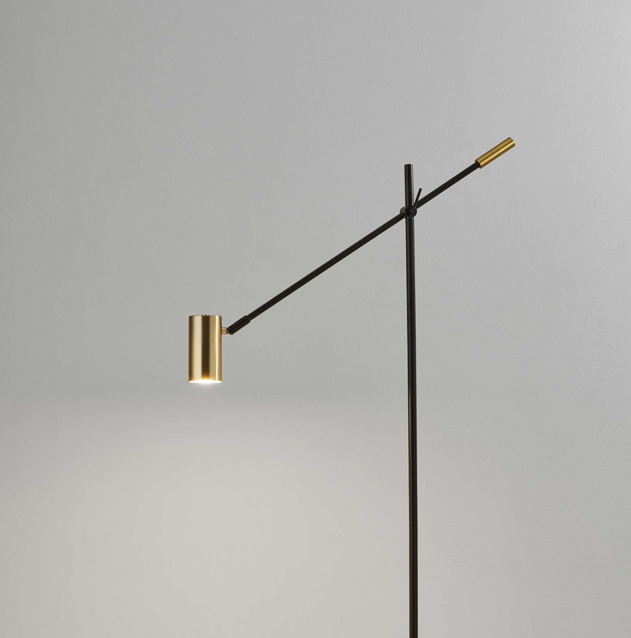 Black Metal Antique Brass Floor Lamp with adjustable tilt arm and LED task light, showcasing modern design and elegant finishes.