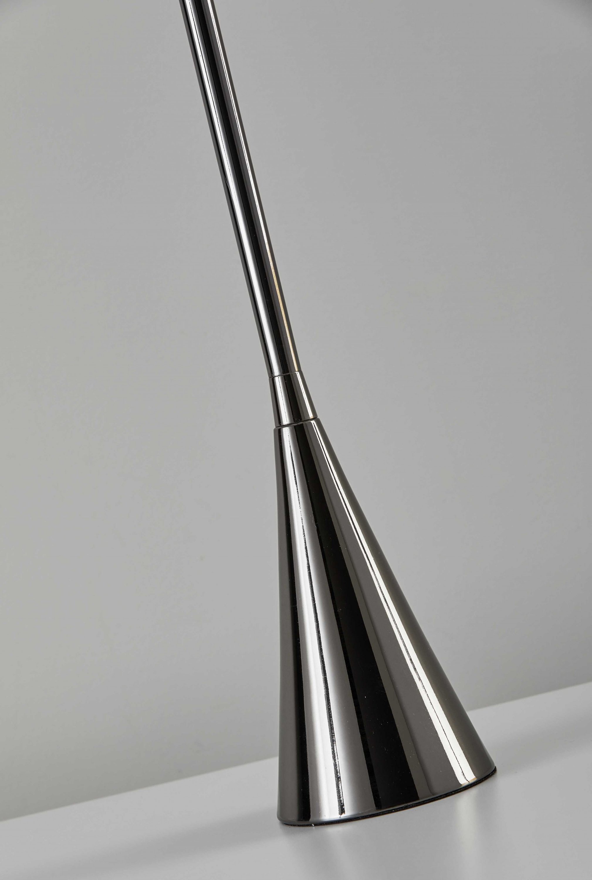 Black Nickel Finish Metal Tall White Shade Table Lamp with a cylindrical white shade and a bell-shaped weighted base.