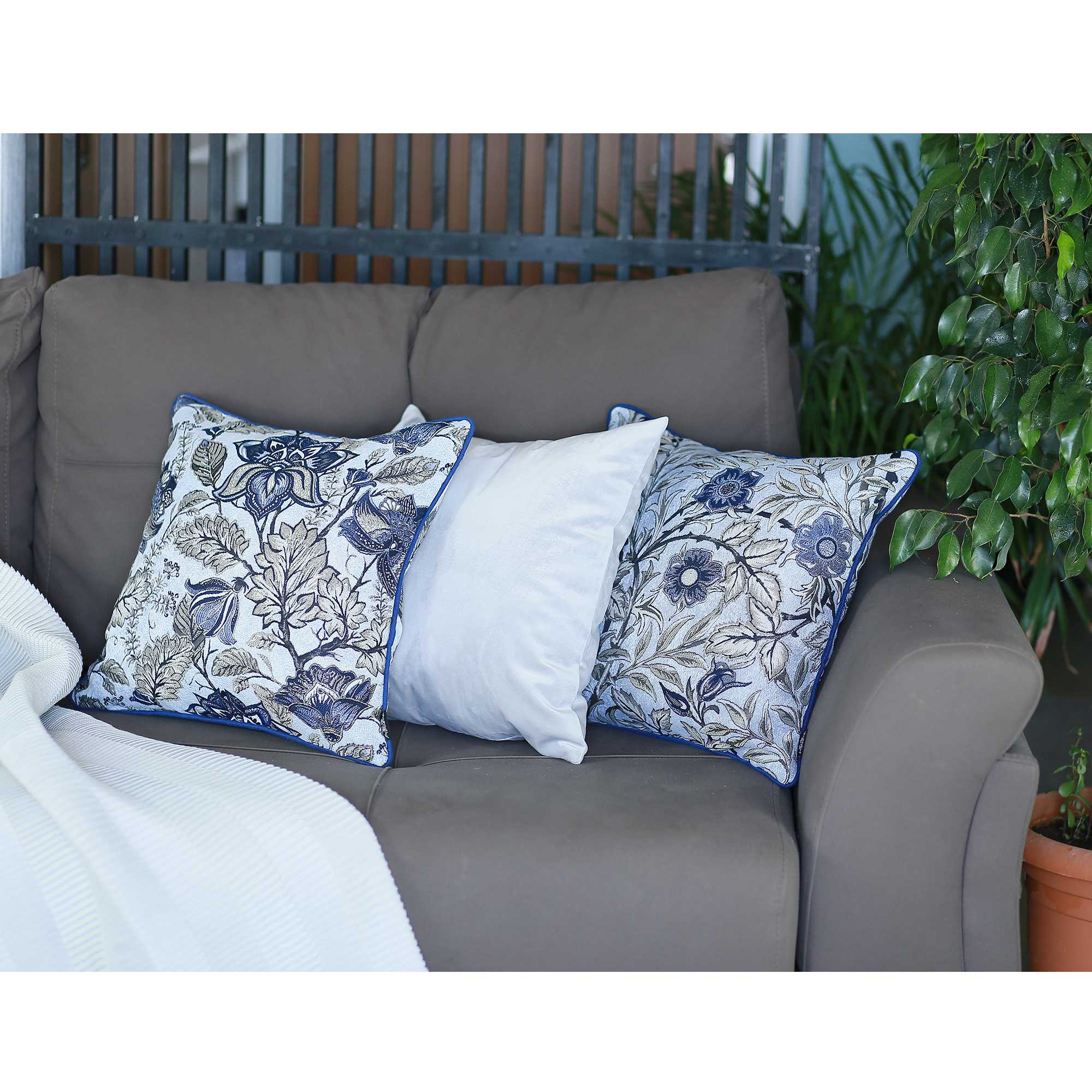 Blue jacquard leaf decorative throw pillow cover featuring a luxurious leaf pattern in blue and beige, with a hidden zipper closure.