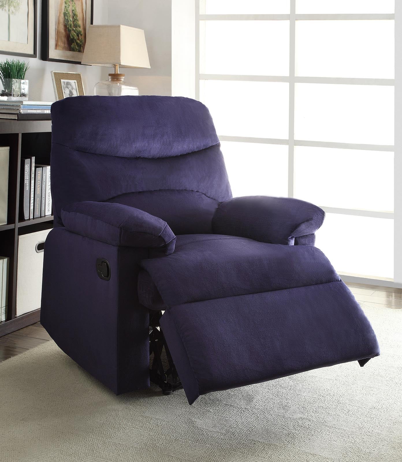 Blue woven fabric upholstered recliner with a smooth seat cushion and external reclining handle, showcasing its stylish design and comfort.