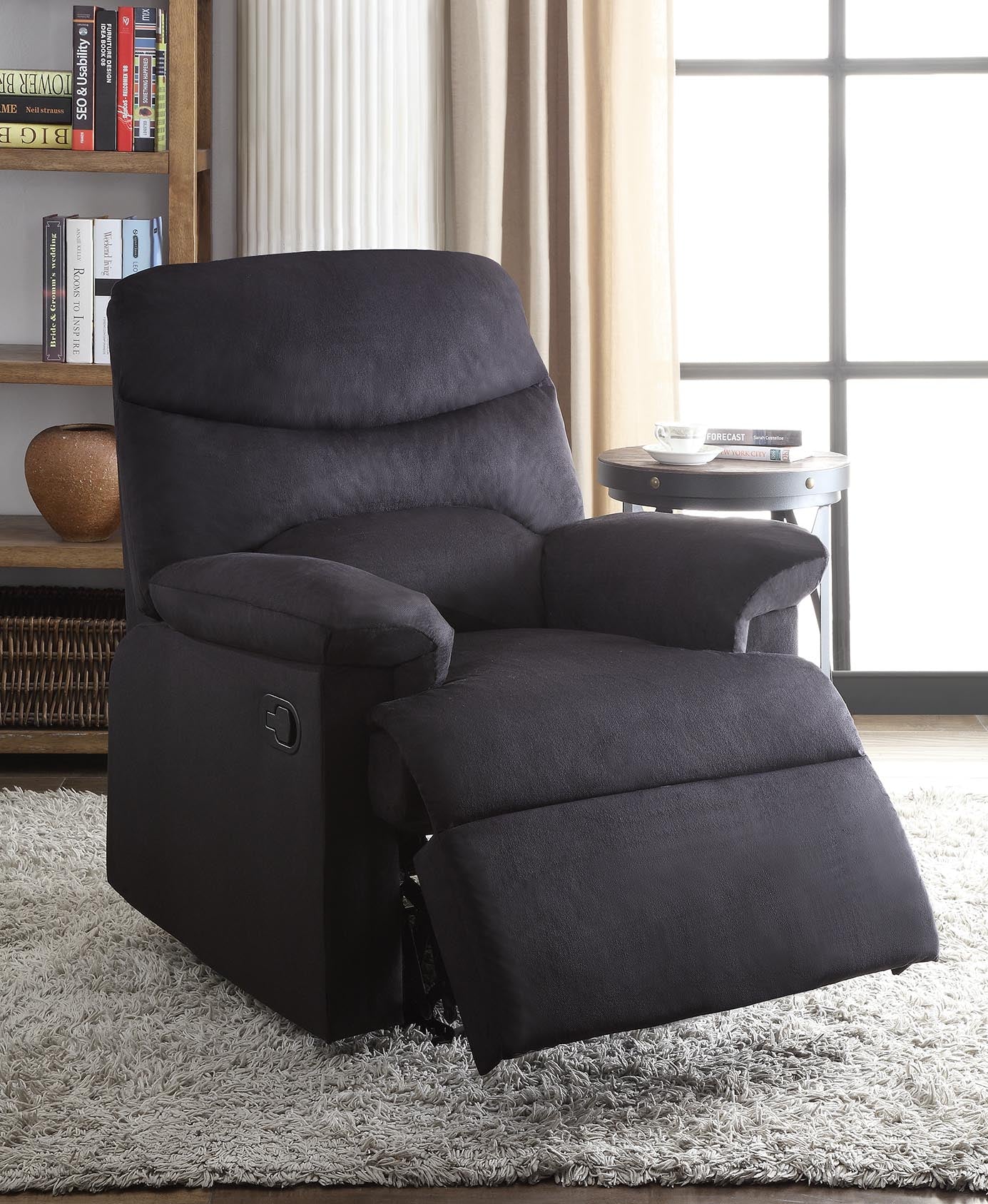 Blue woven fabric upholstered recliner with a smooth seat cushion and external reclining handle, showcasing its stylish design and comfort.