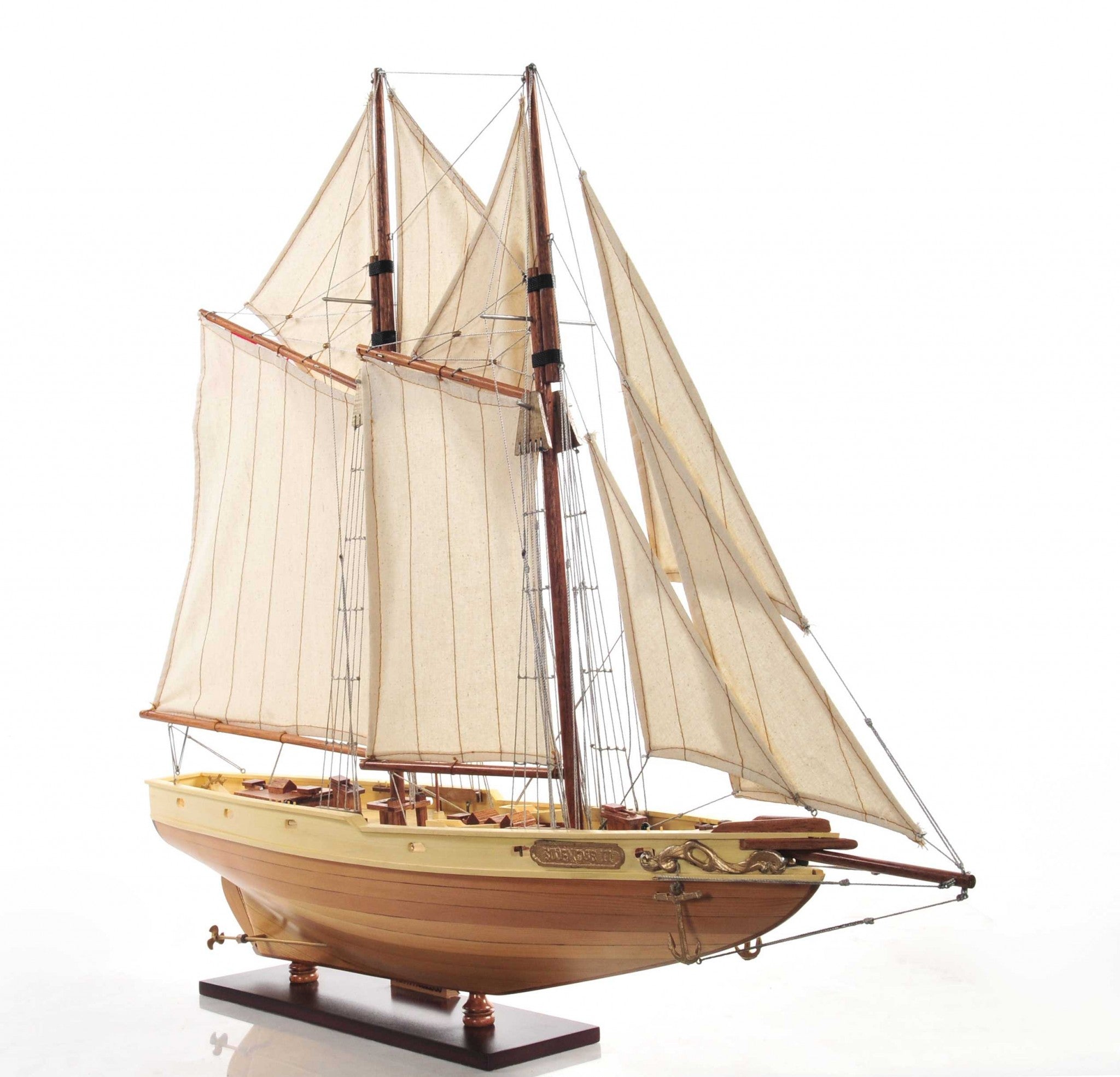 Bluenose model ship in light brown finish showcasing detailed rigging, lifeboats, and wooden craftsmanship.