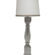 Brown washed wood finish table lamp with a white linen shade, showcasing its elegant design and soft lighting.