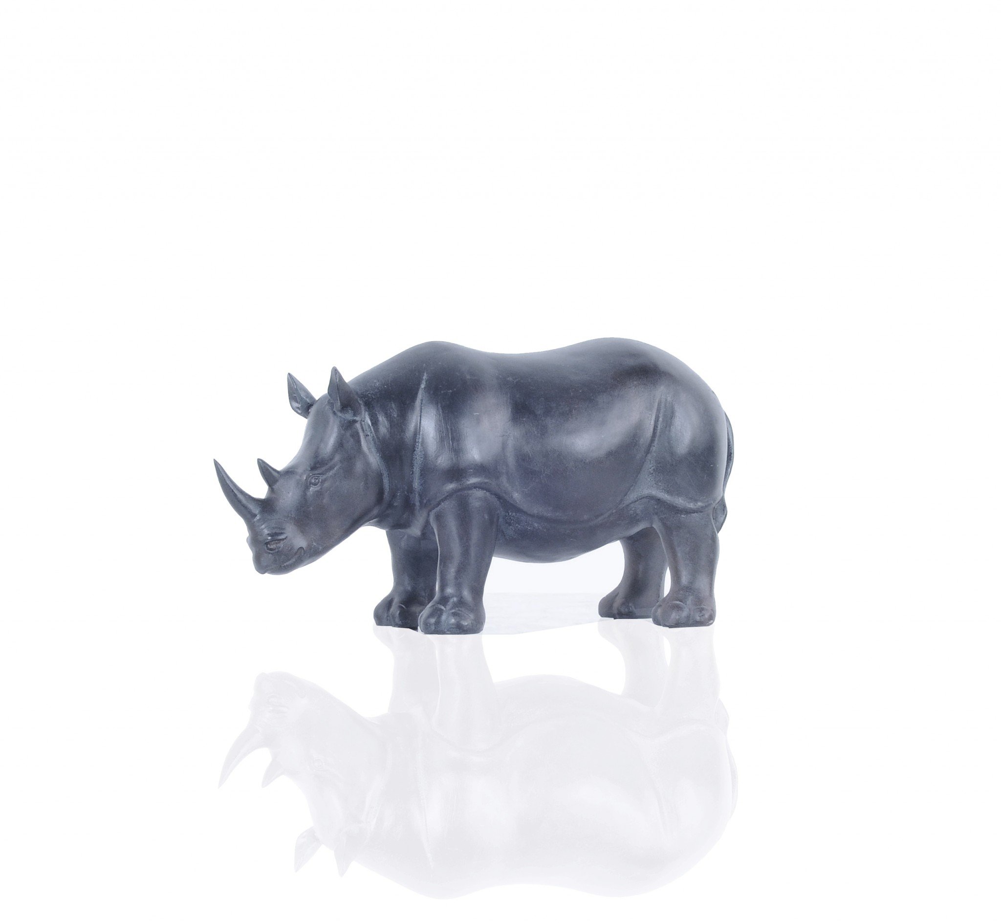 A stunning burnished bronze and black rhinoceros statue, showcasing intricate details and a powerful stance, perfect for home or office decor.