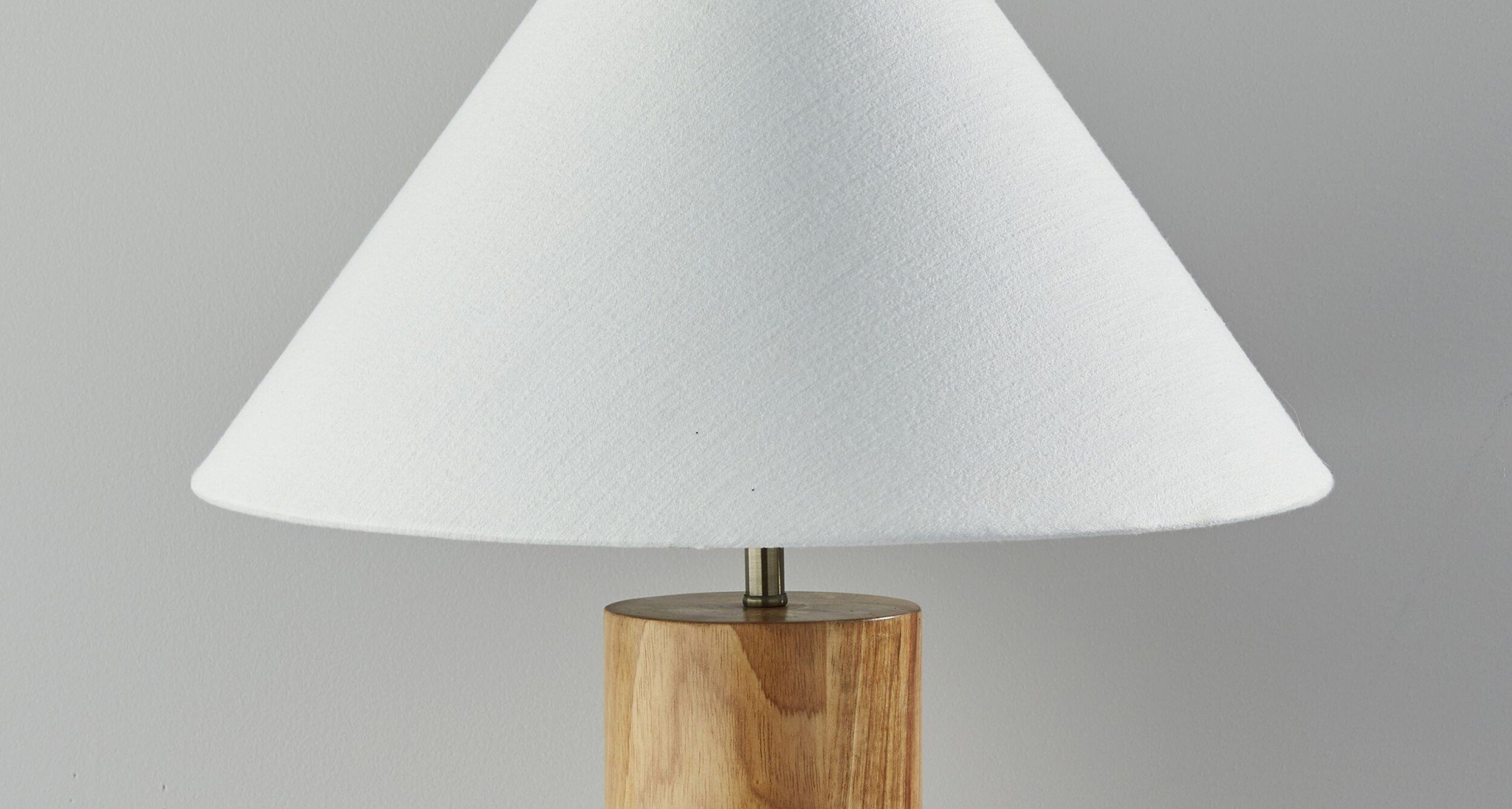 Canopy Natural Wood Block Table Lamp featuring a circular oak wood base and white textured fabric shade with antique brass accents.