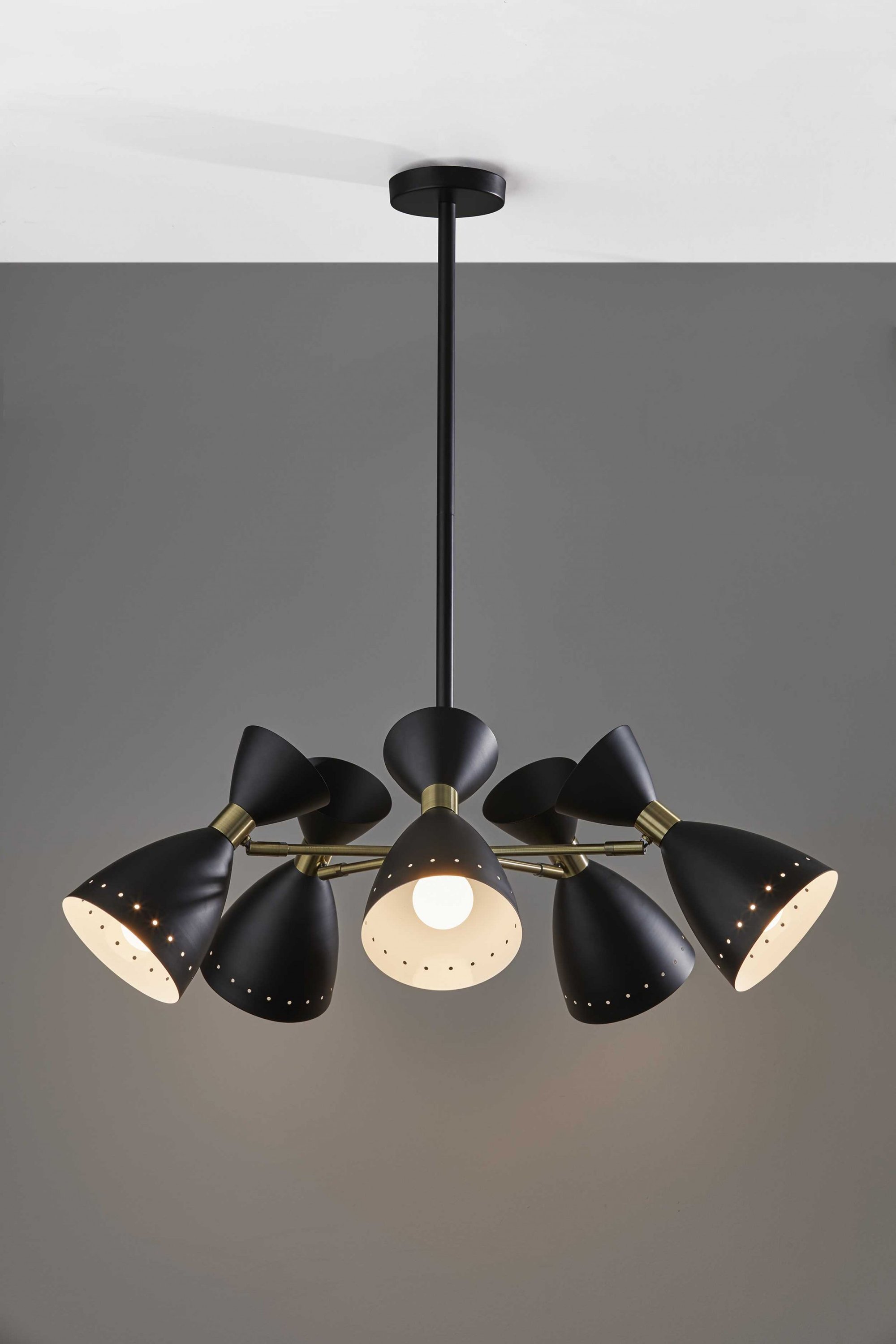 Cinco Diabolo Adjustable Black Metal Pendant with five oversized shades in black and antique brass finishes, showcasing mid-century modern design.