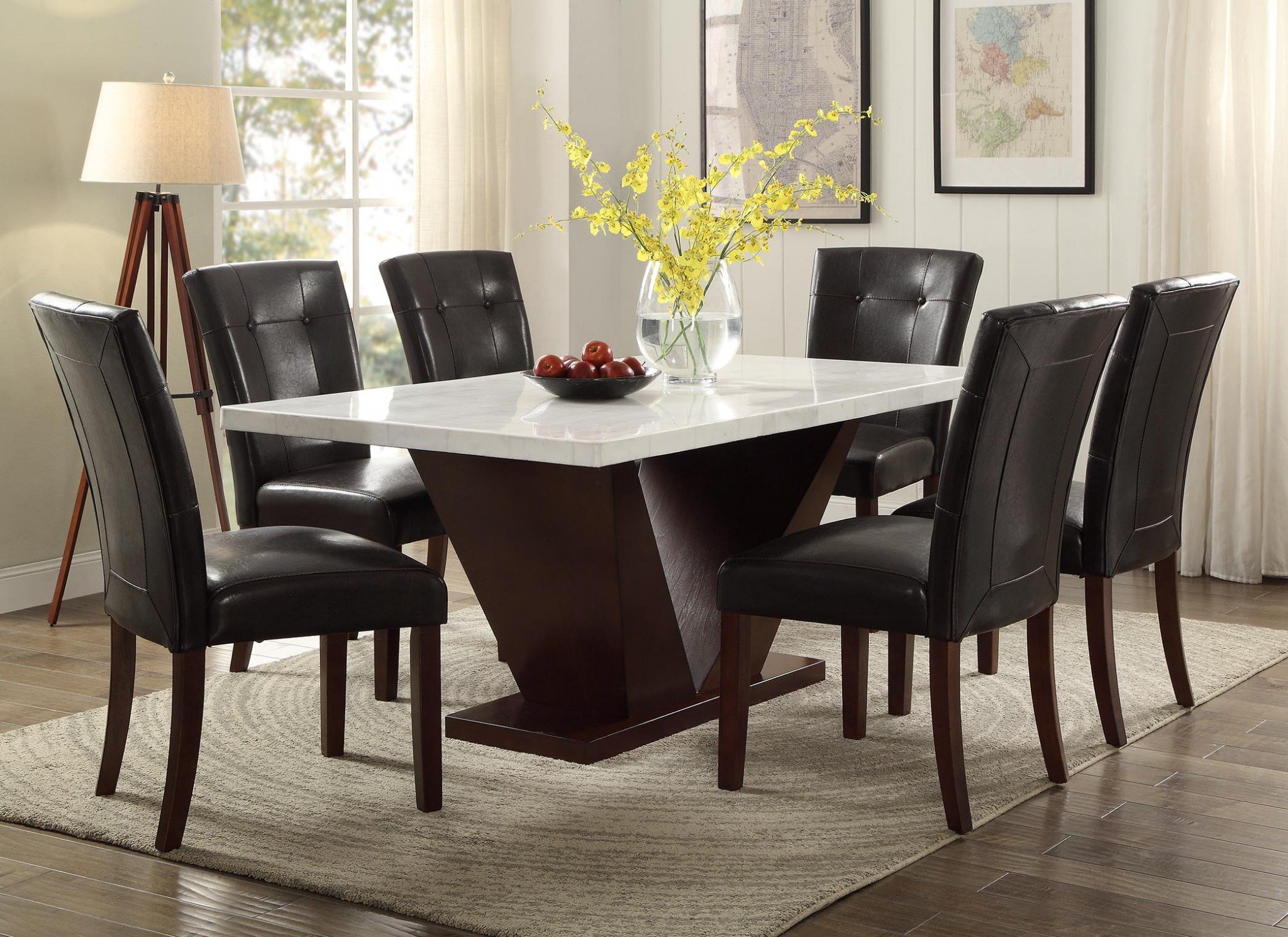 Contemporary white marble dining table with walnut V-shape pedestal, elegantly designed for modern dining spaces.