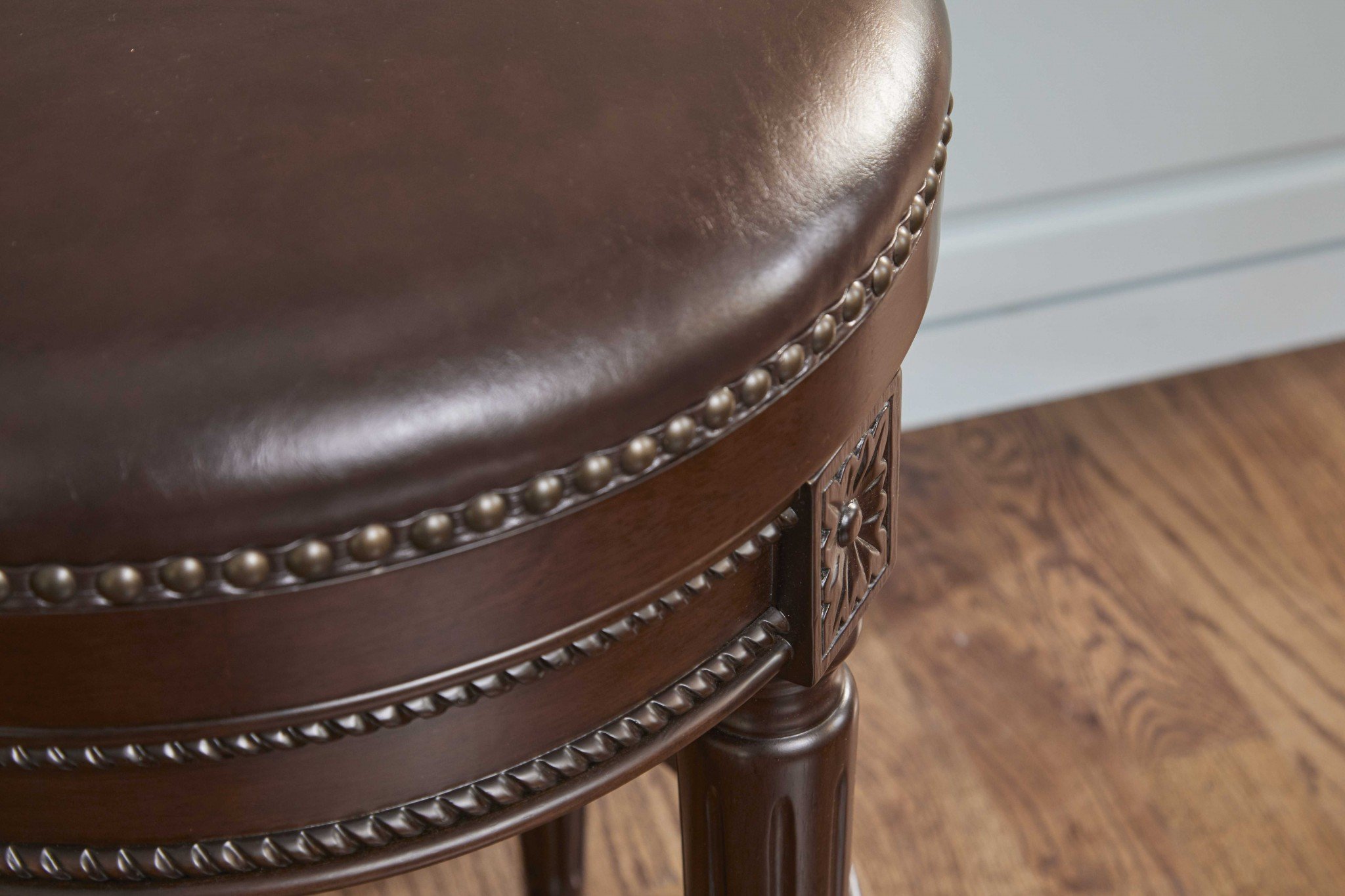 Counter height stool in distressed walnut finish, featuring a backless design and full swivel seat, perfect for modern and rustic interiors.