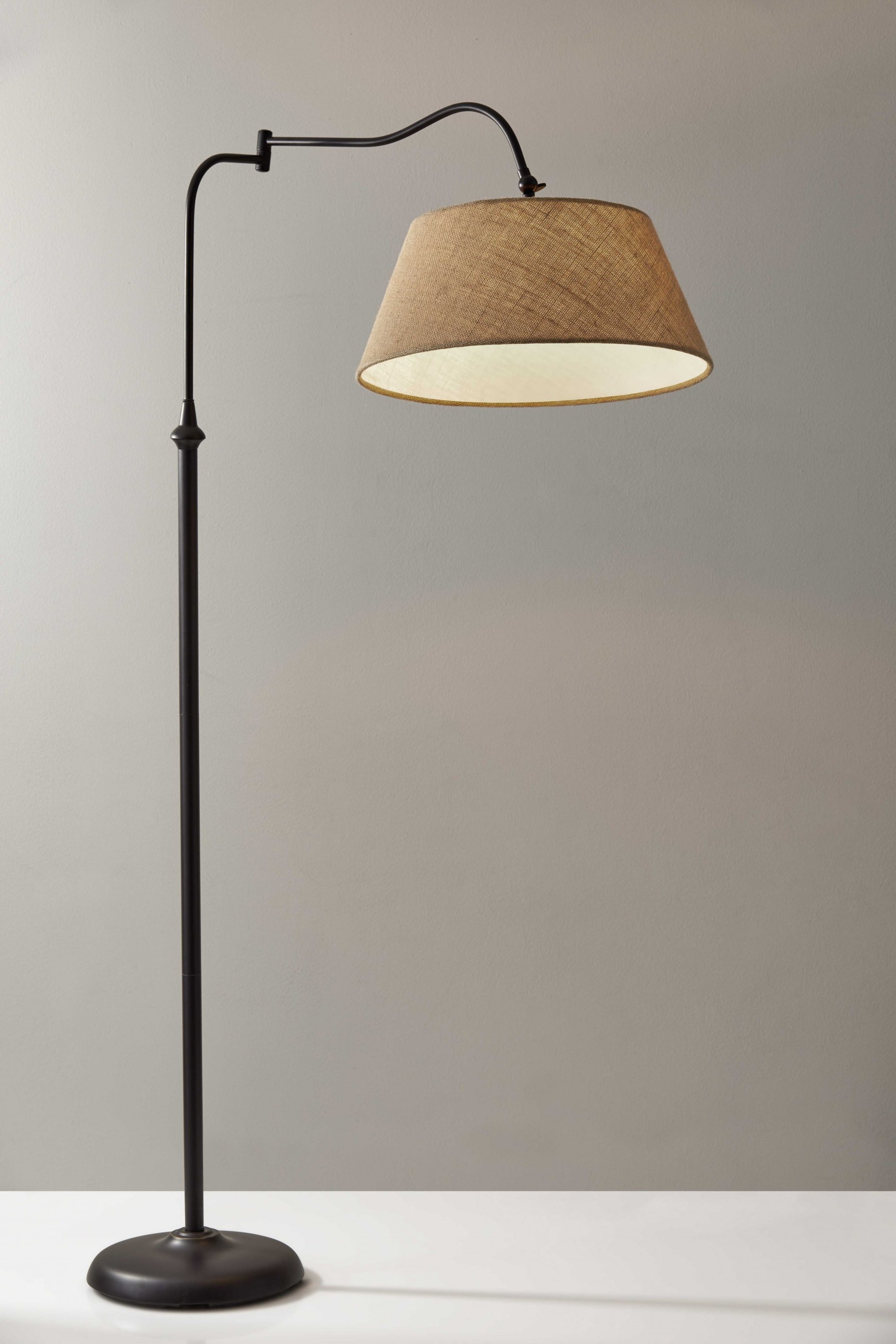 Dark bronze metal floor lamp with adjustable swing arm and textured burlap shade, standing tall at 61 inches.