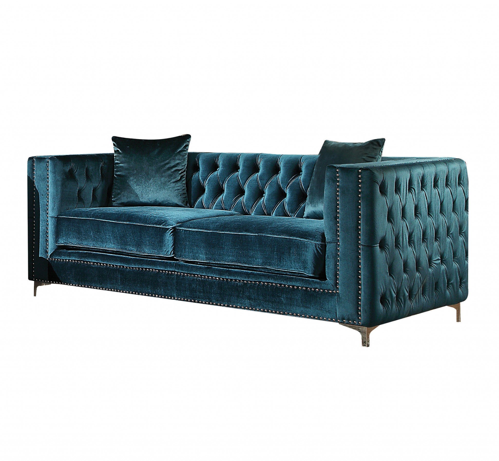 Dark teal velvet loveseat with two pillows, featuring tufted design and silver stainless steel legs.