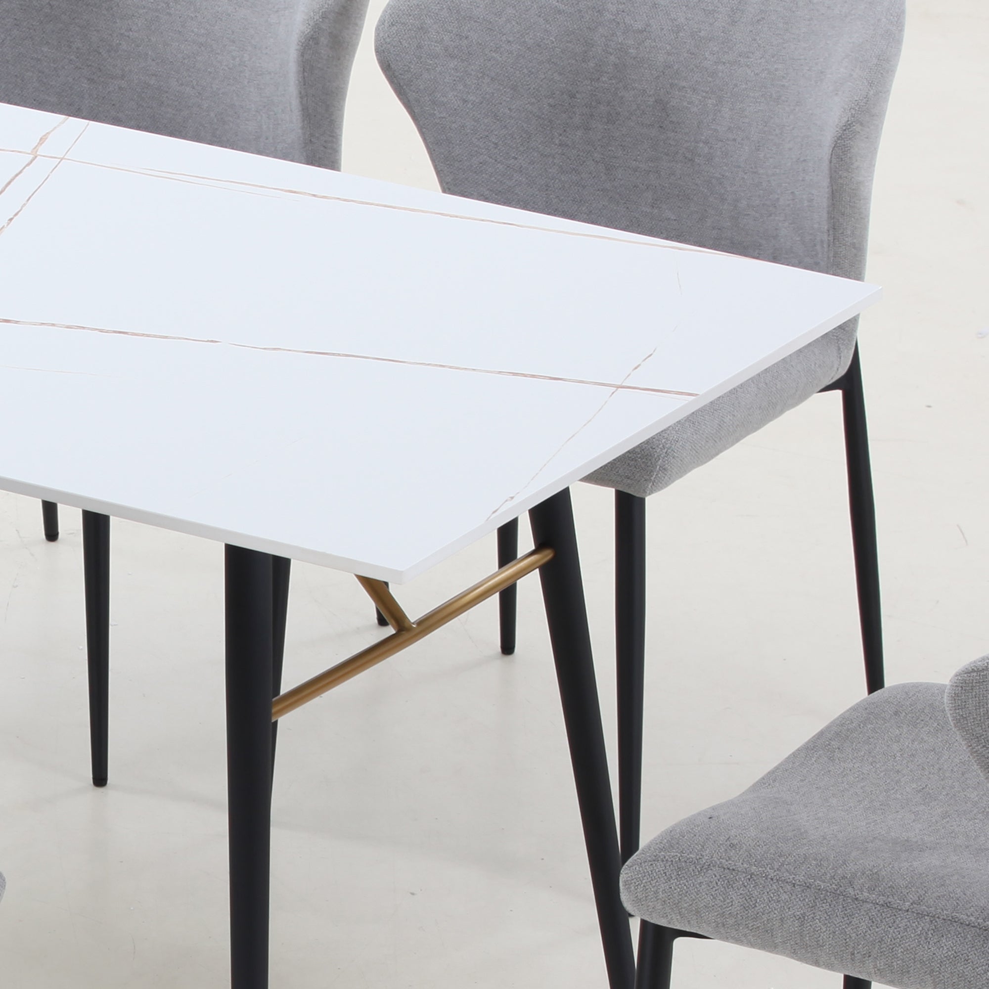 Elegant white porcelain dining table with metal legs, suitable for 4-8 persons, showcasing a modern design.