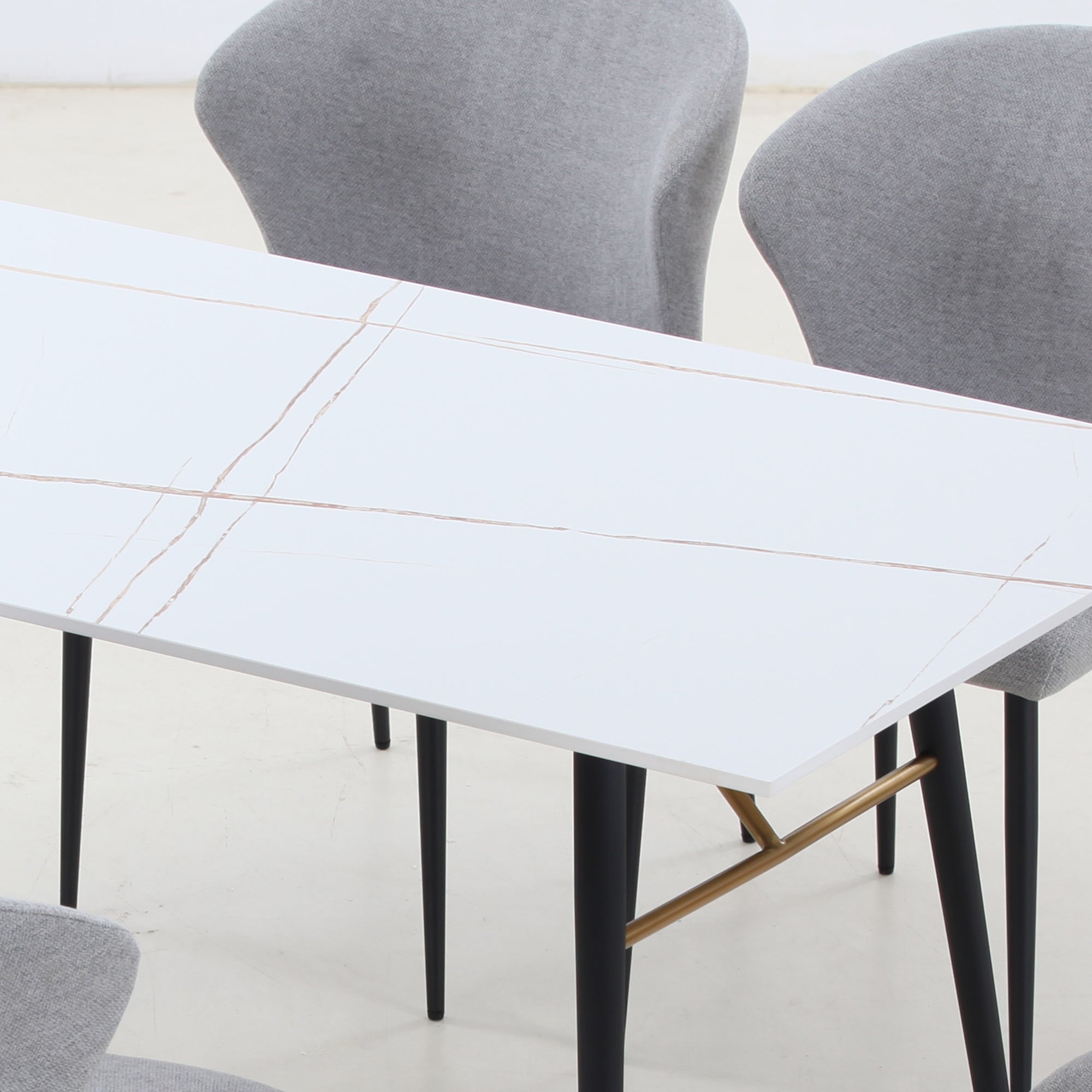 Elegant white porcelain dining table with metal legs, suitable for 4-8 persons, showcasing a modern design.