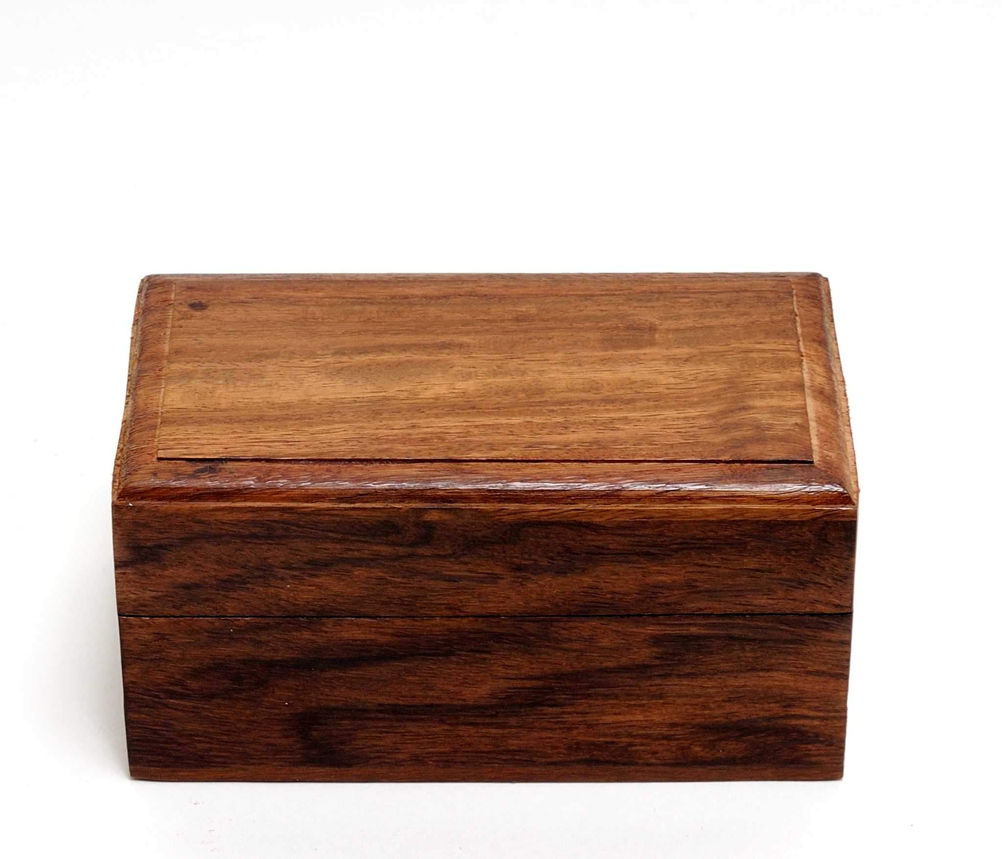 Elegant mother of pearl opera glasses with brass body in a stylish wood storage box, perfect for theater viewing.