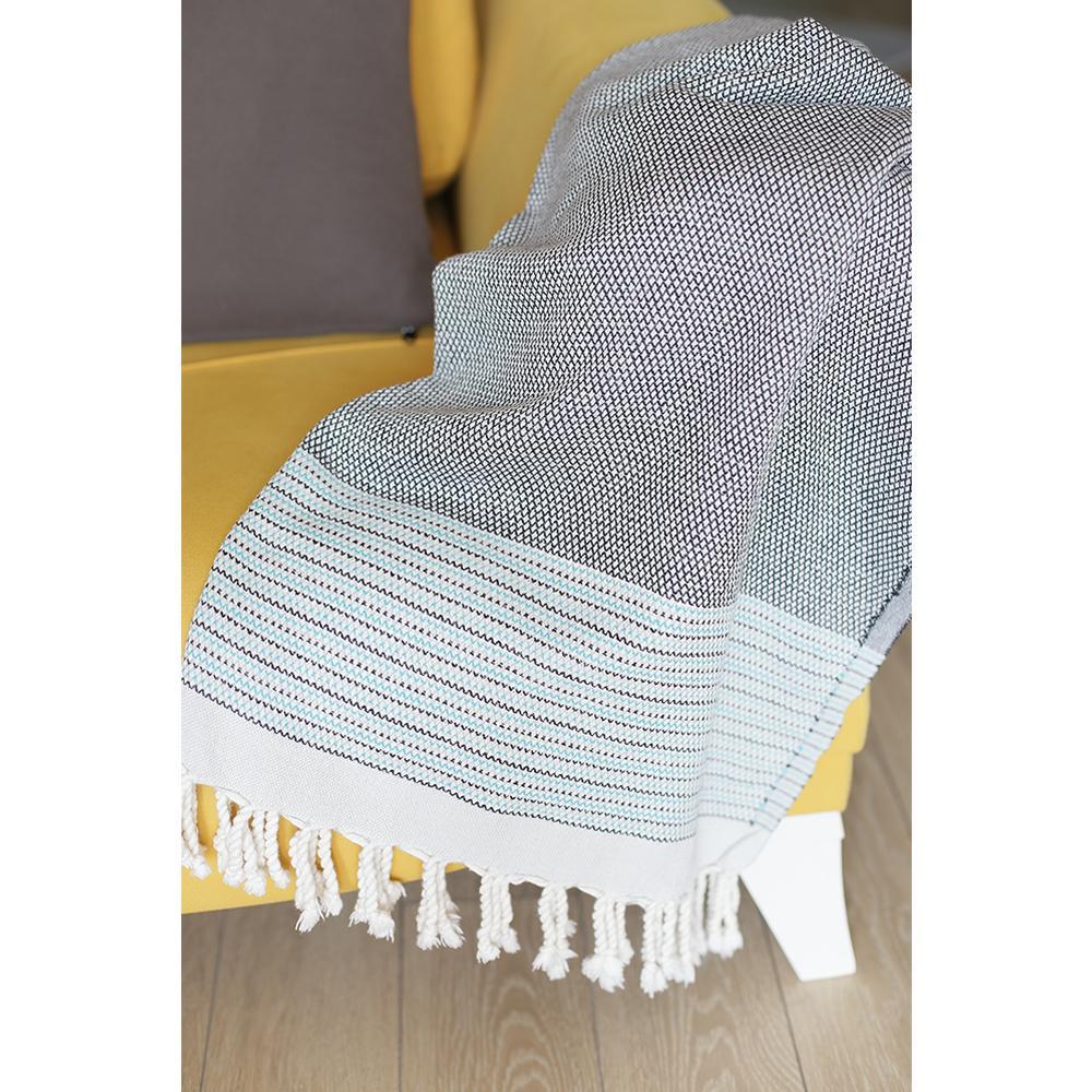 A beautifully handcrafted grey and blue striped Turkish towel or throw blanket, showcasing soft cotton fabric with fringe edges.