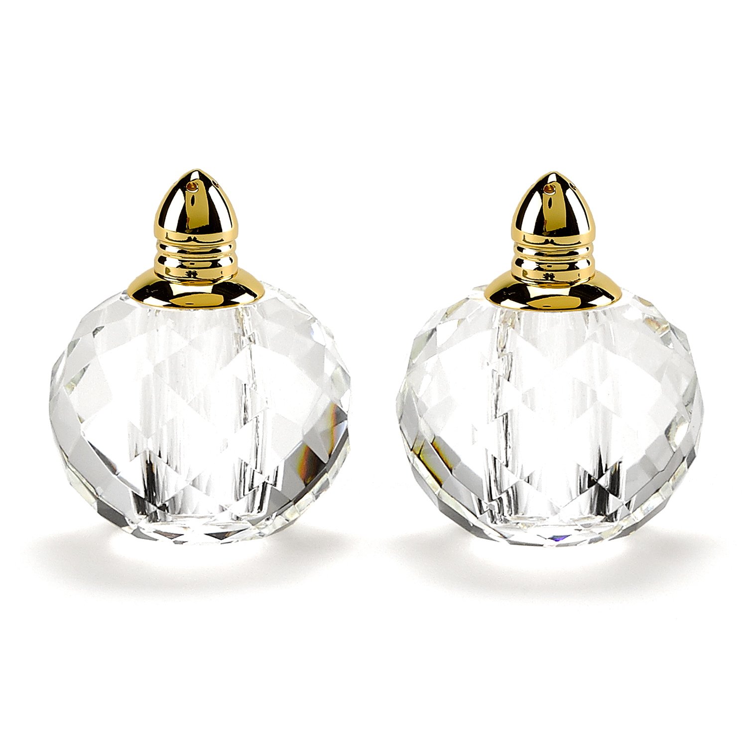 Handcrafted optical crystal and gold rounded salt and pepper shakers, showcasing elegant design and luxurious accents.