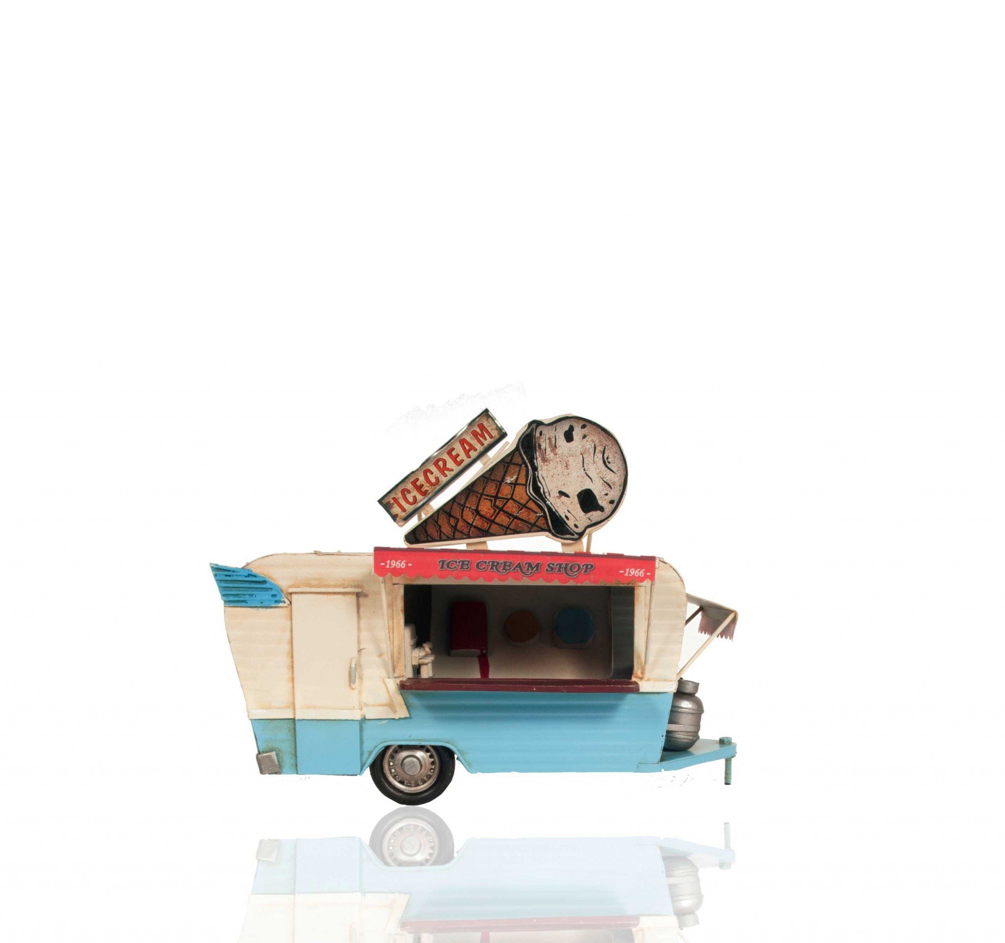 A detailed handmade metal model of an ice cream trailer featuring vibrant signs, a freezer, and turnable wheels.