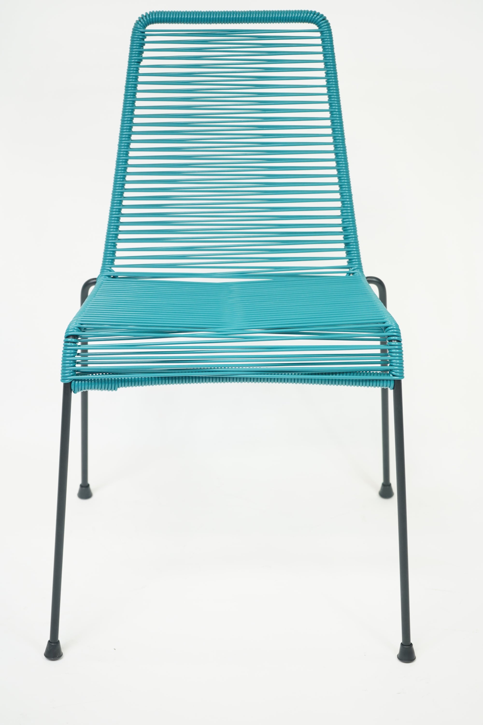 La Turquesa Chair in vibrant turquoise and black, showcasing its contemporary design and inviting curves.