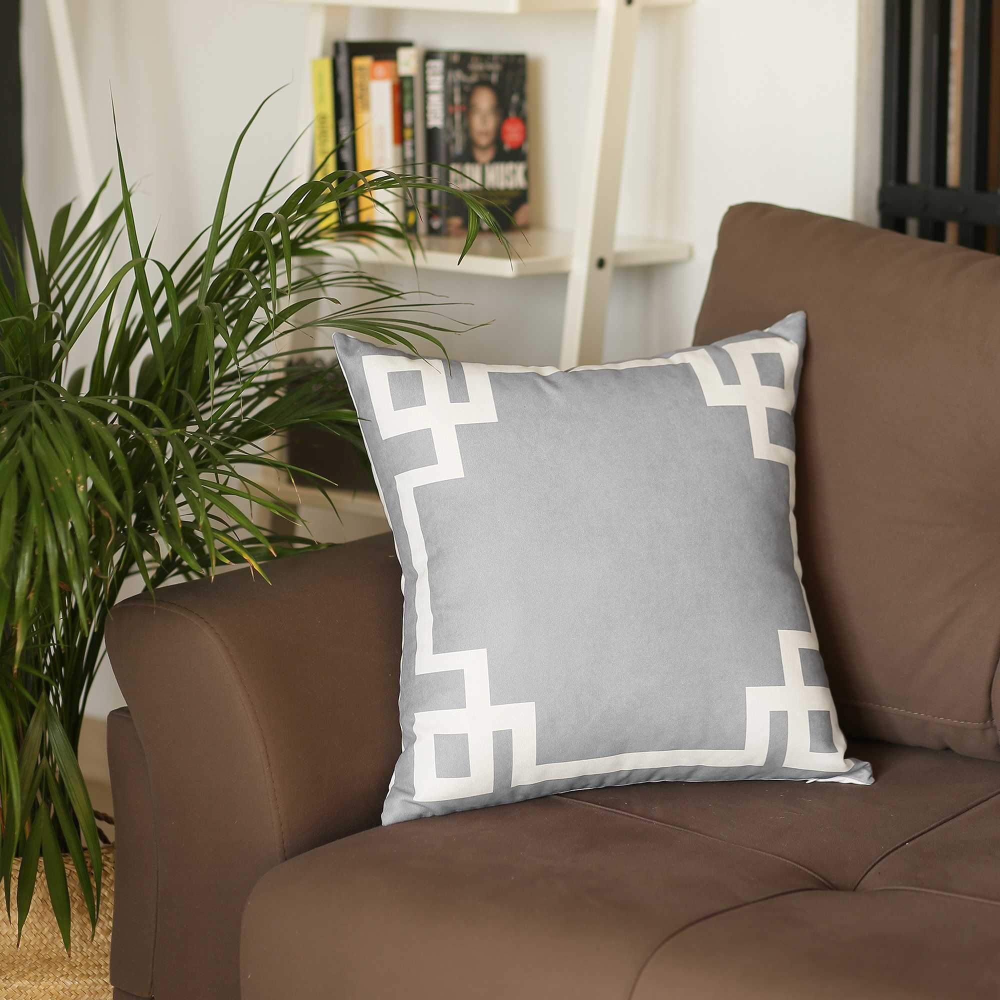 Light grey and white geometric decorative throw pillow cover with hidden zipper, showcasing modern patterns on luxurious brushed fabric.