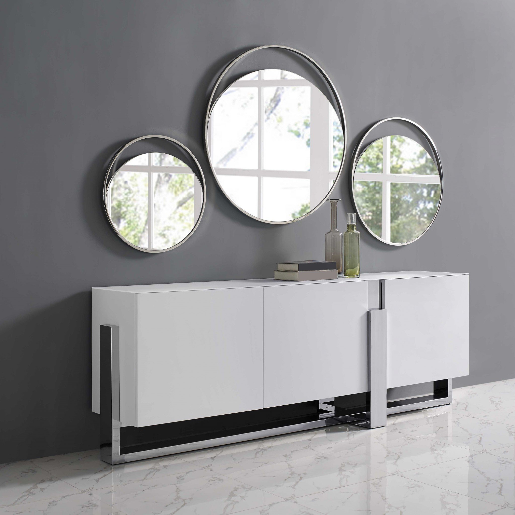 Medium round mirror with a matte white finish and polished stainless steel frame, showcasing a modern and elegant design.