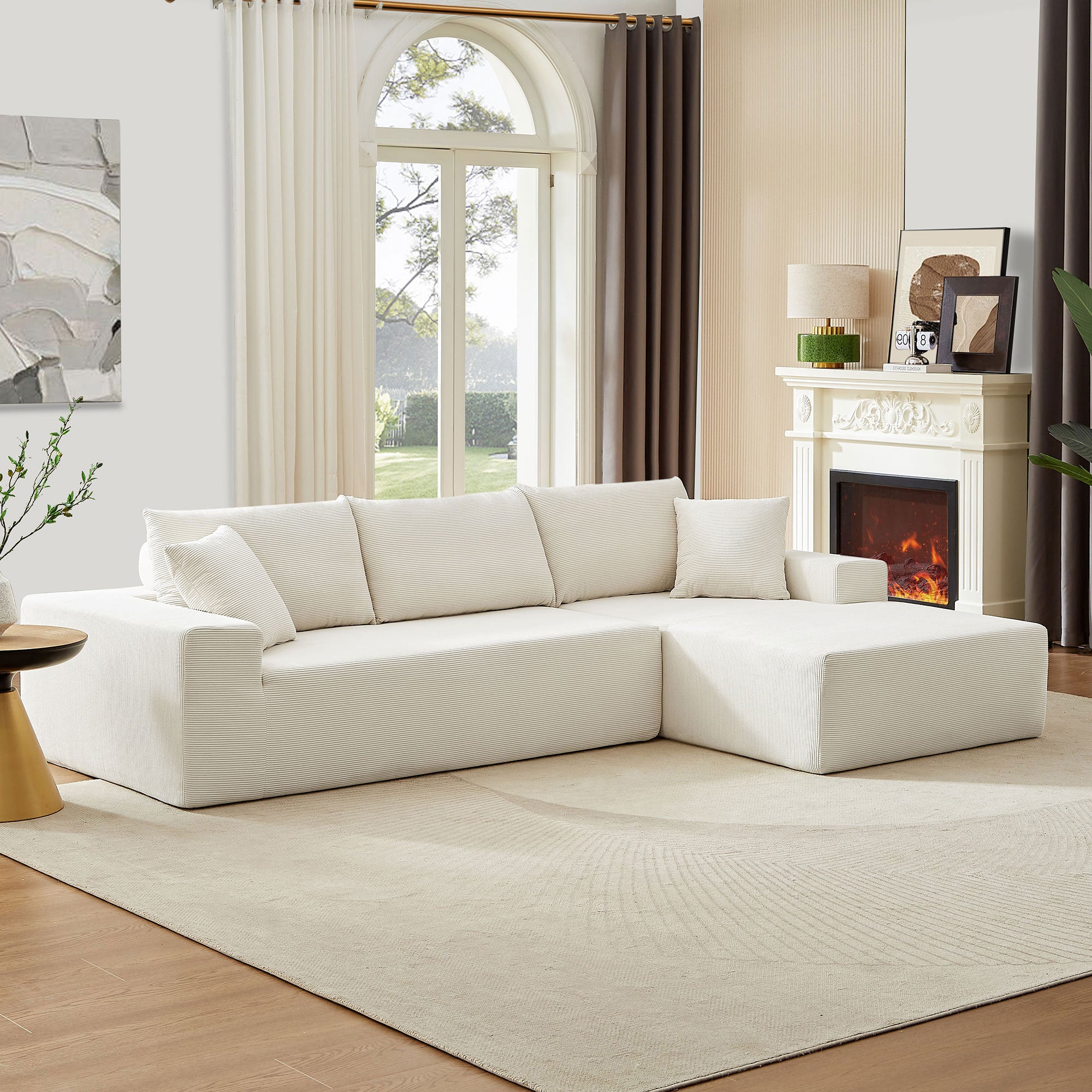 A modern modular sectional living room sofa set in beige upholstery, featuring a chaise lounge and plush cushions, perfect for stylish and comfortable living spaces.