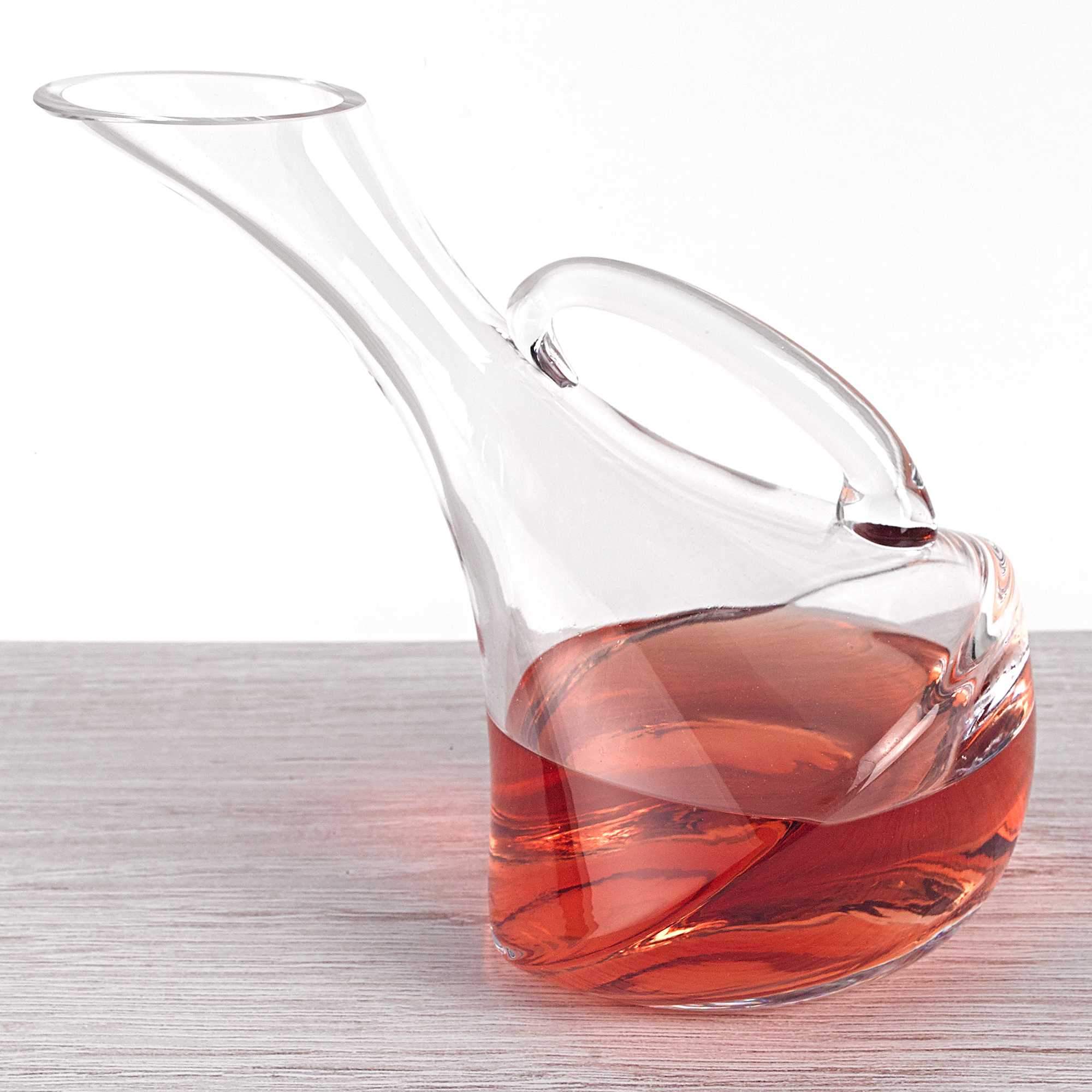 A stunning mouth blown glass wine carafe, 32 oz capacity, showcasing its elegant design and clarity, perfect for serving wine.