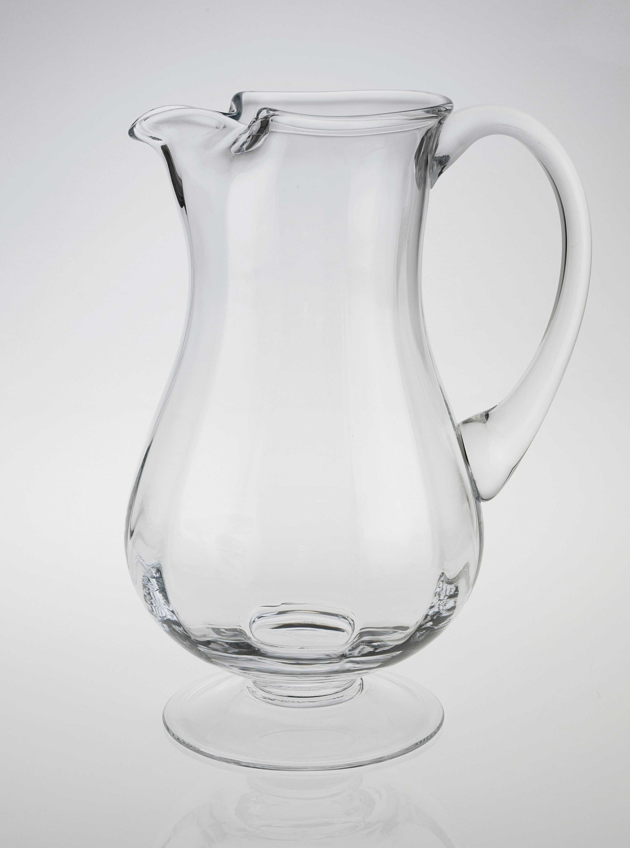 A beautiful mouth blown lead free crystal pitcher with a 54 oz capacity, showcasing its elegant design and clear finish, perfect for serving drinks.