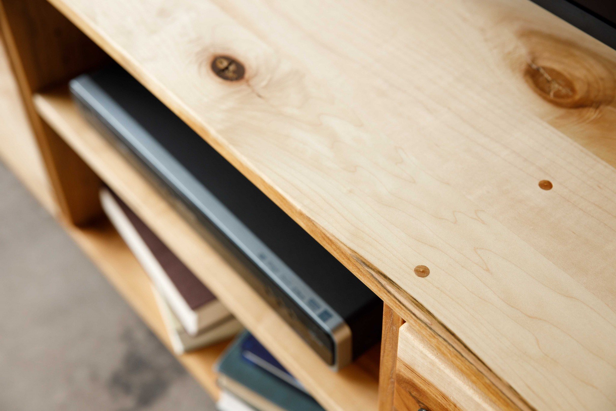 Natural Maple and Black Steel TV Stand showcasing mid-century modern design with spacious storage for media accessories.