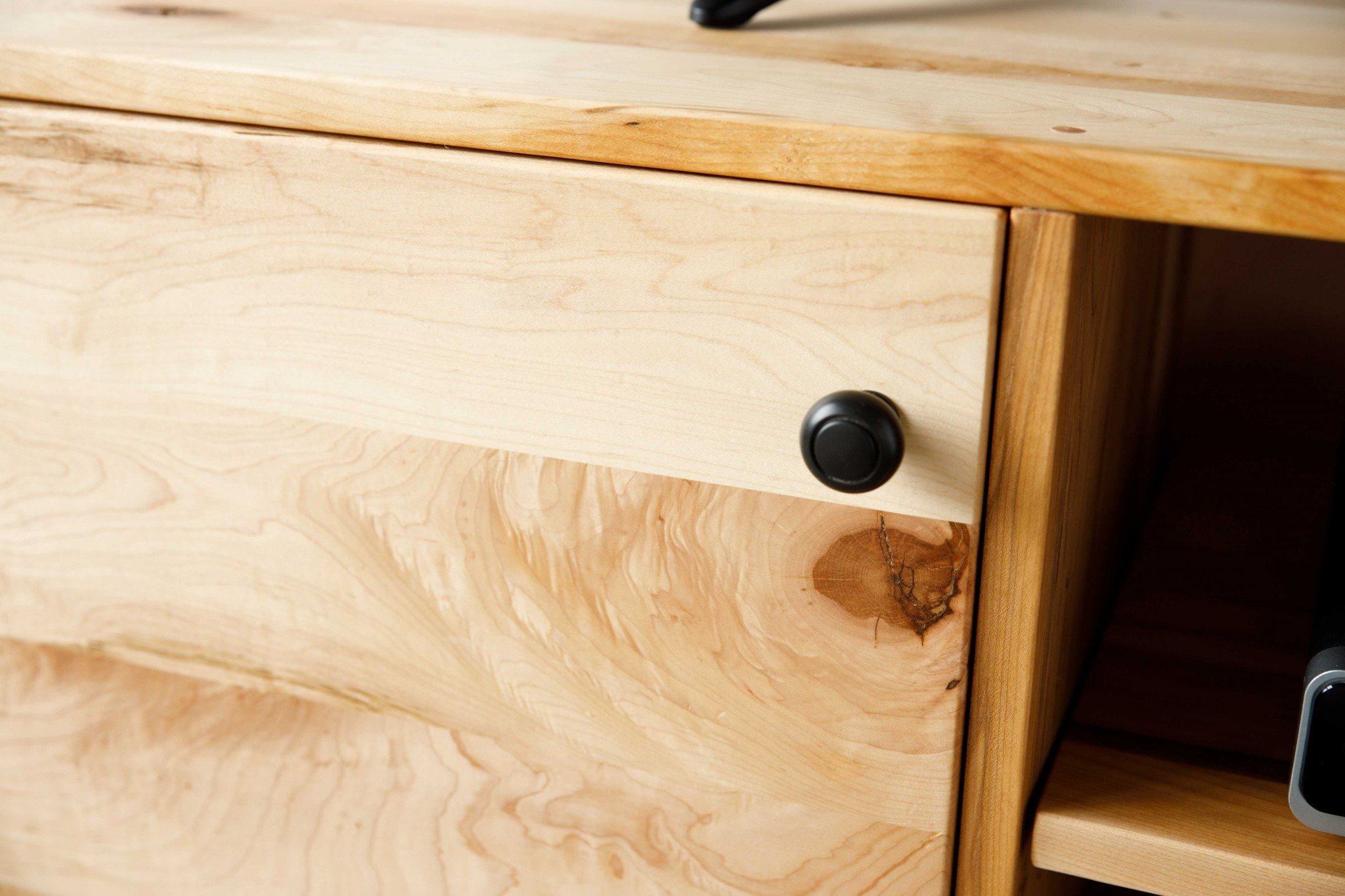 Natural Maple and Black Steel TV Stand showcasing mid-century modern design with spacious storage for media accessories.