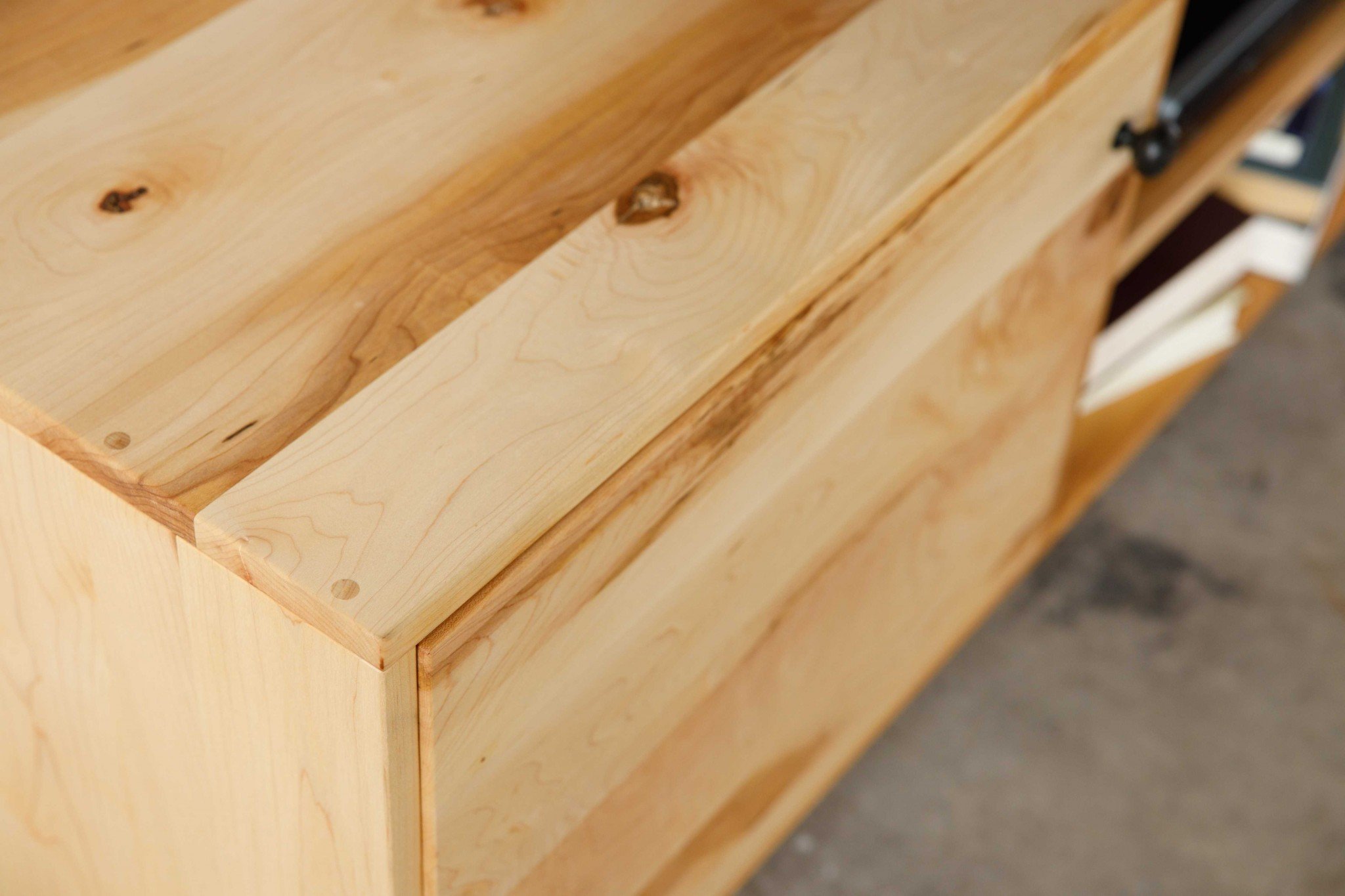 Natural Maple and Black Steel TV Stand showcasing mid-century modern design with spacious storage for media accessories.