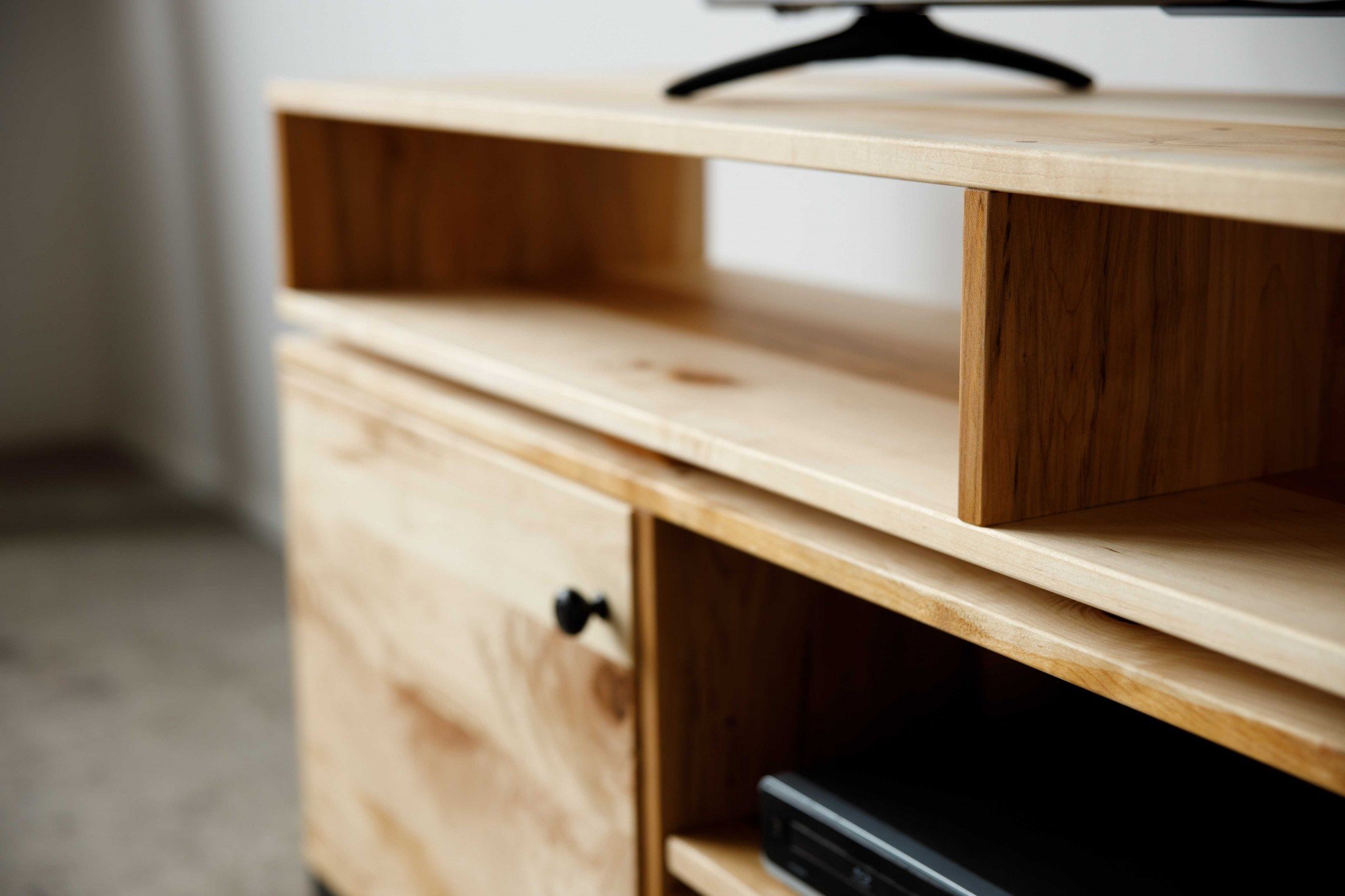 Natural Maple and Steel Multi Compartment TV Stand showcasing mid-century modern design with multiple storage compartments.