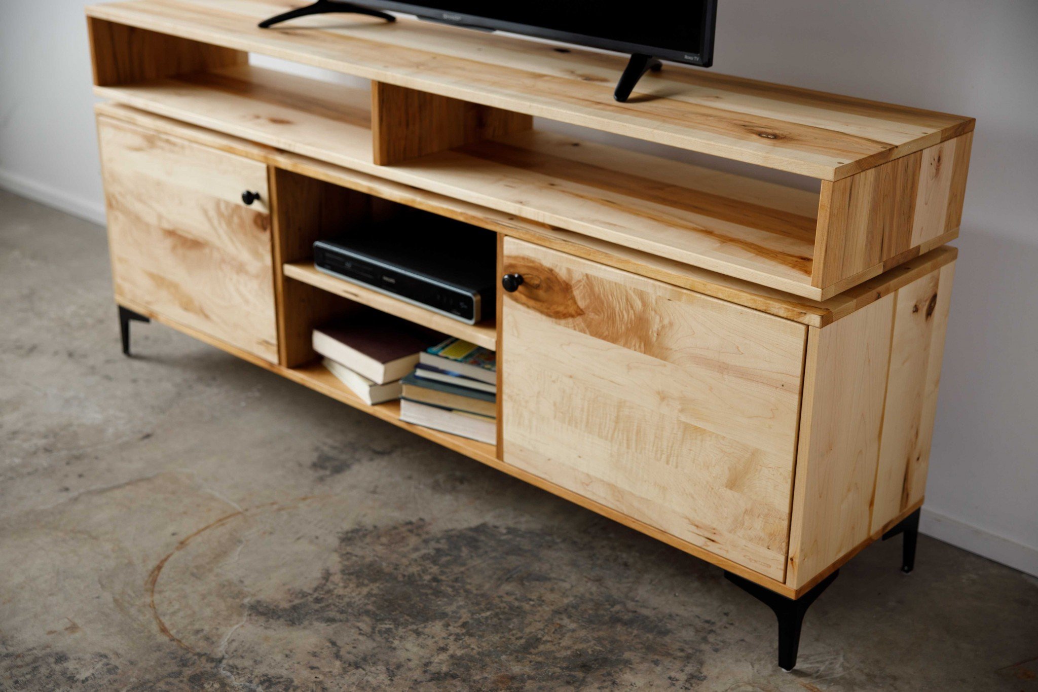 Natural Maple and Steel Multi Compartment TV Stand showcasing mid-century modern design with multiple storage compartments.