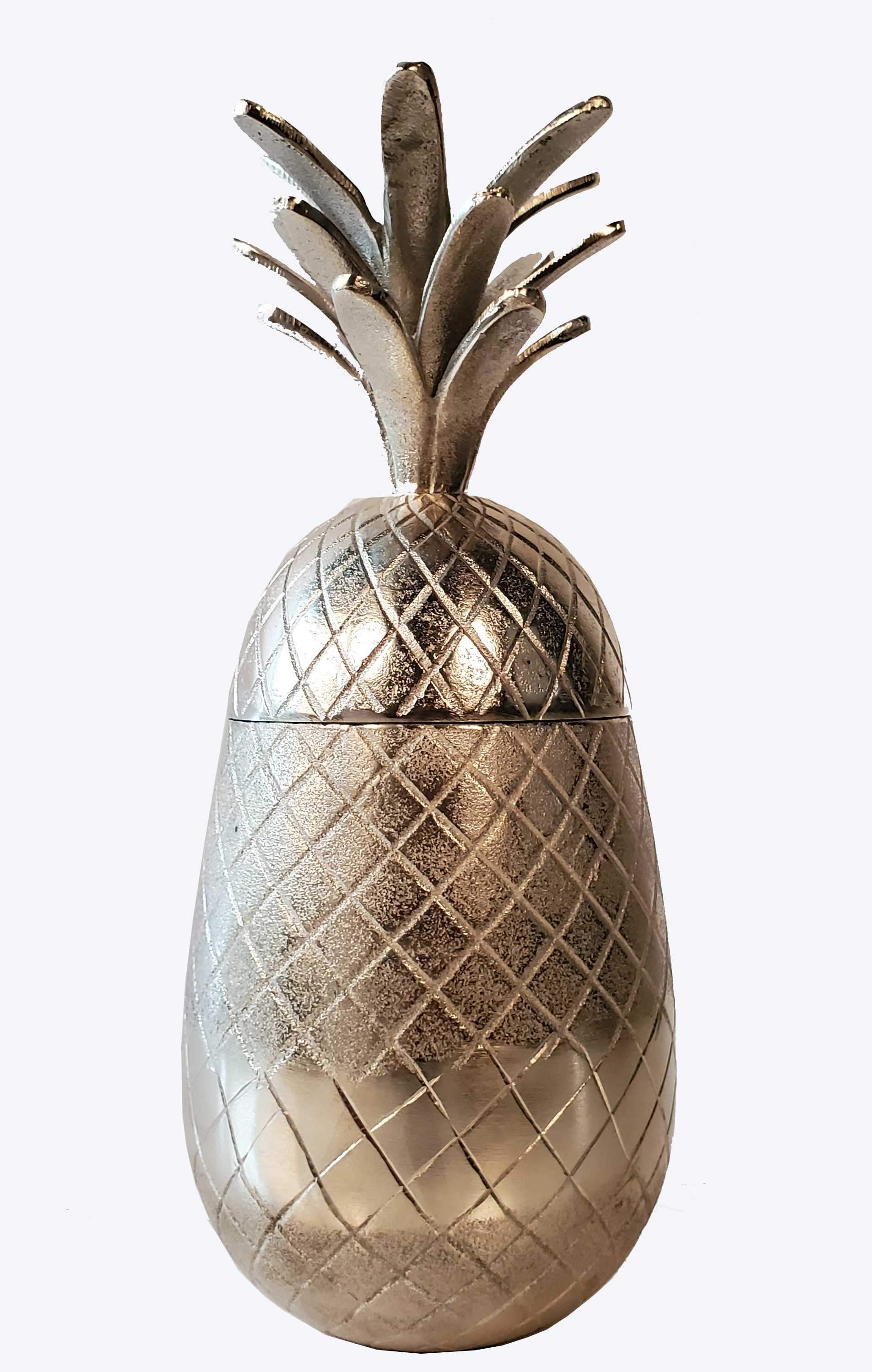 Vibrant pineapple-shaped aluminum decor with a storage compartment, perfect for beach-themed interiors.