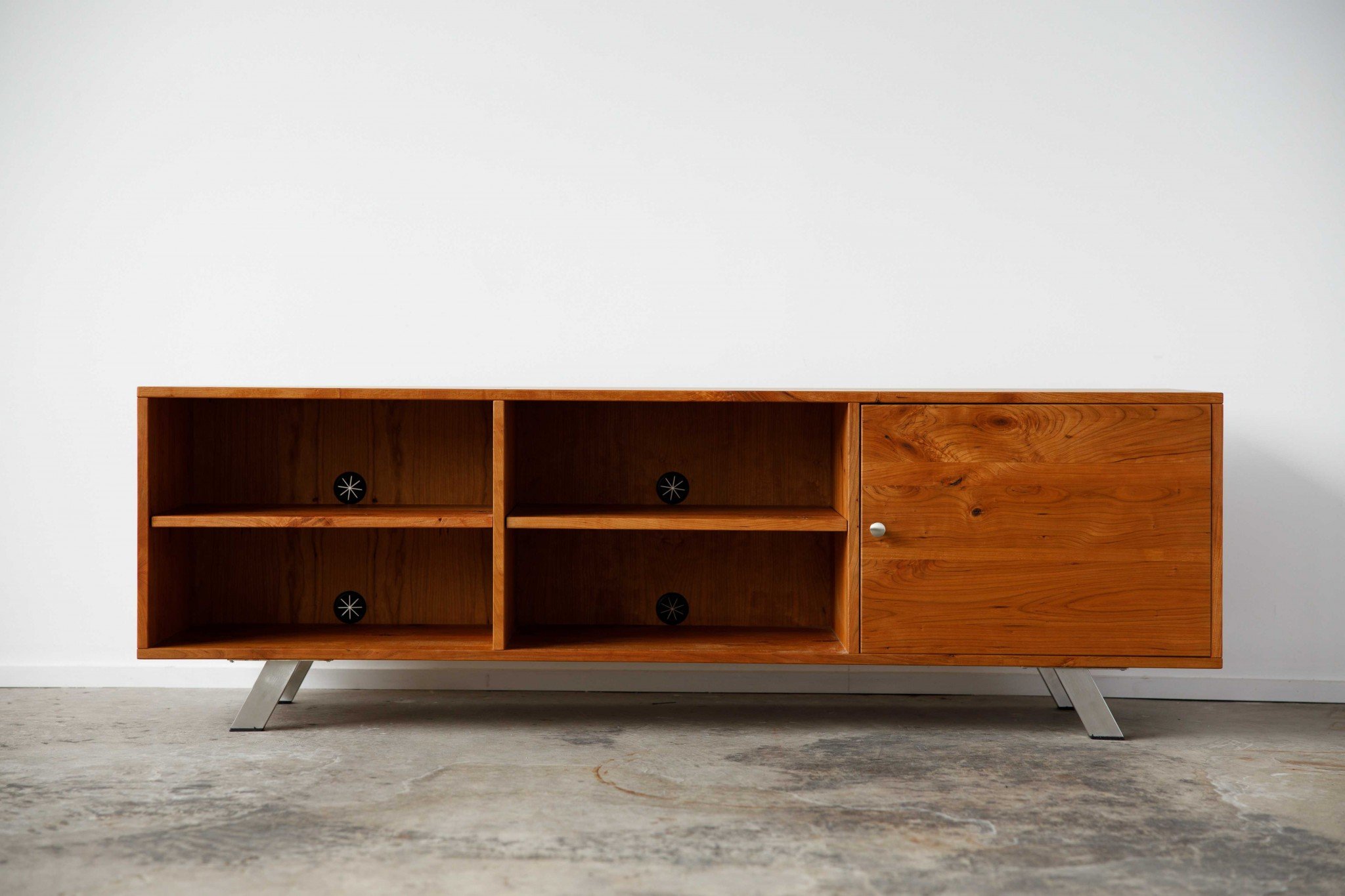 Retro Warm Natural Cherry and Steel TV Stand showcasing mid-century modern design with spacious shelves for media storage.