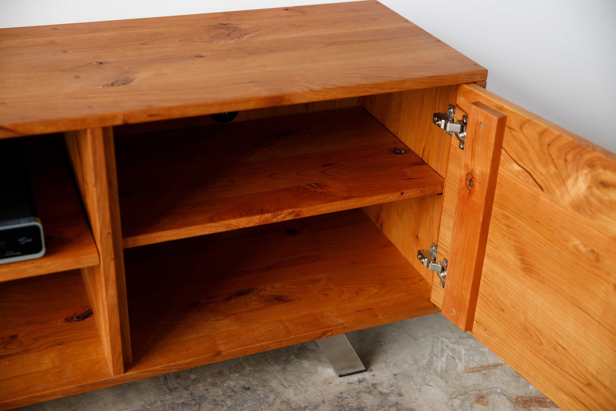 Retro Warm Natural Cherry and Steel TV Stand showcasing mid-century modern design with spacious shelves for media storage.