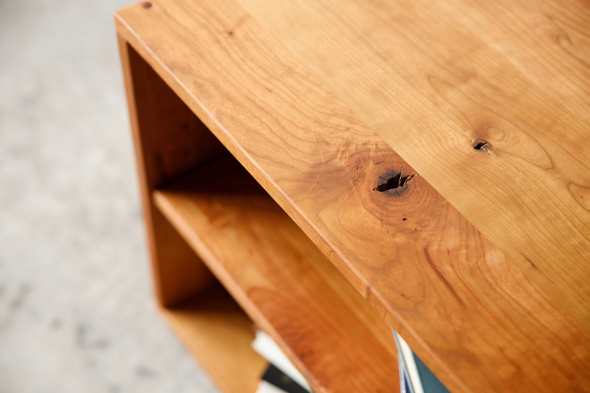 Retro Warm Natural Cherry and Steel TV Stand showcasing mid-century modern design with spacious shelves for media storage.