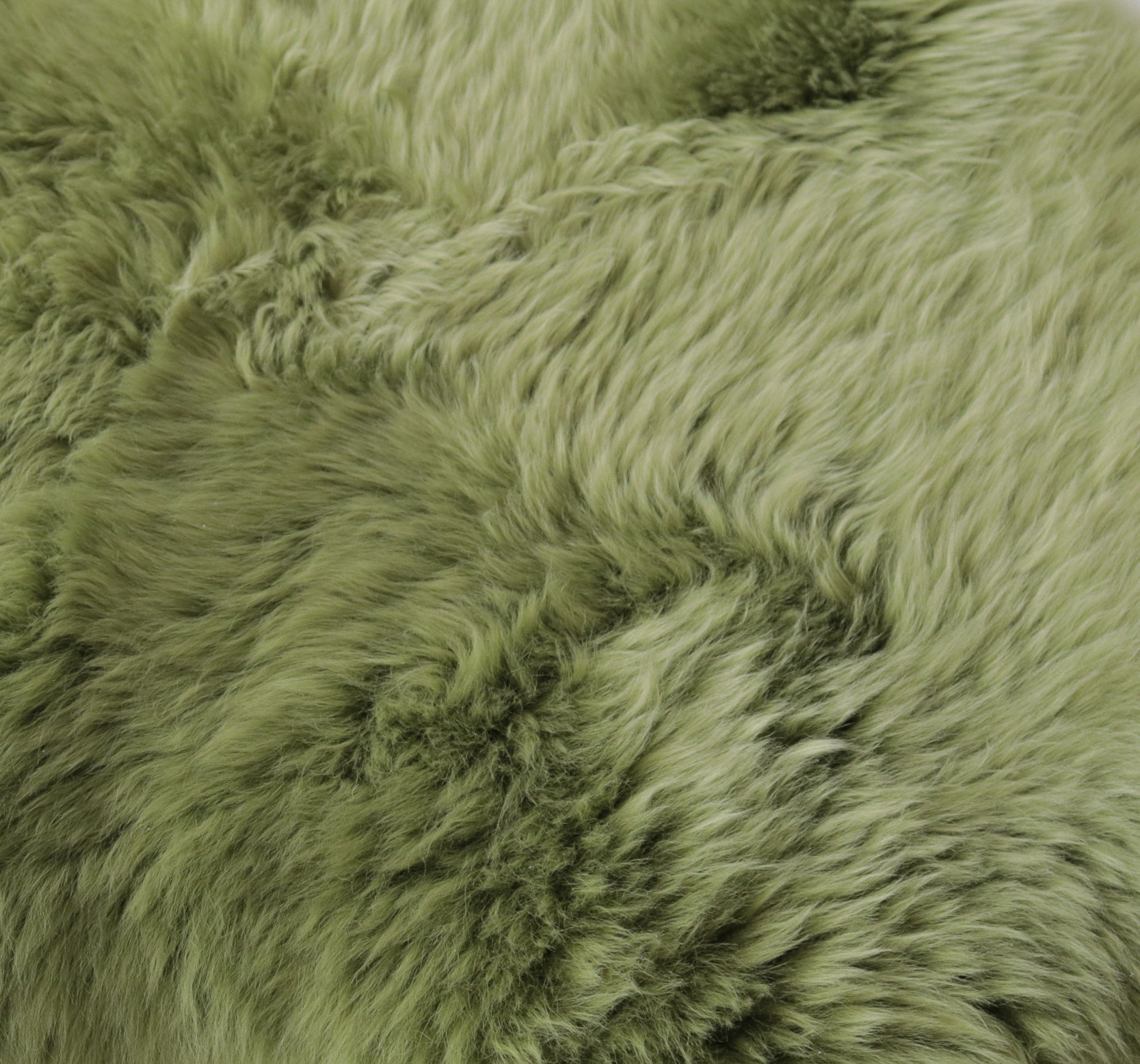 Sage Green New Zealand Natural Sheepskin Rug showcasing its soft texture and elegant color, perfect for home decor.