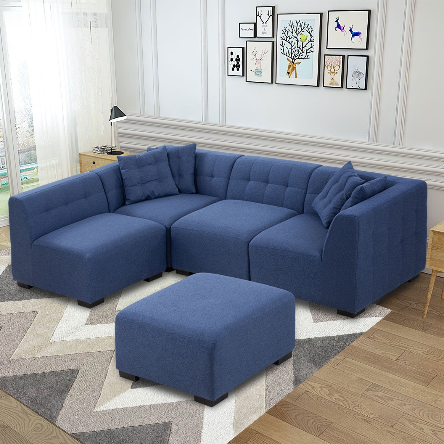 A stylish dark blue sectional sofa with an ottoman, showcasing a modern design and comfortable seating, perfect for living rooms.