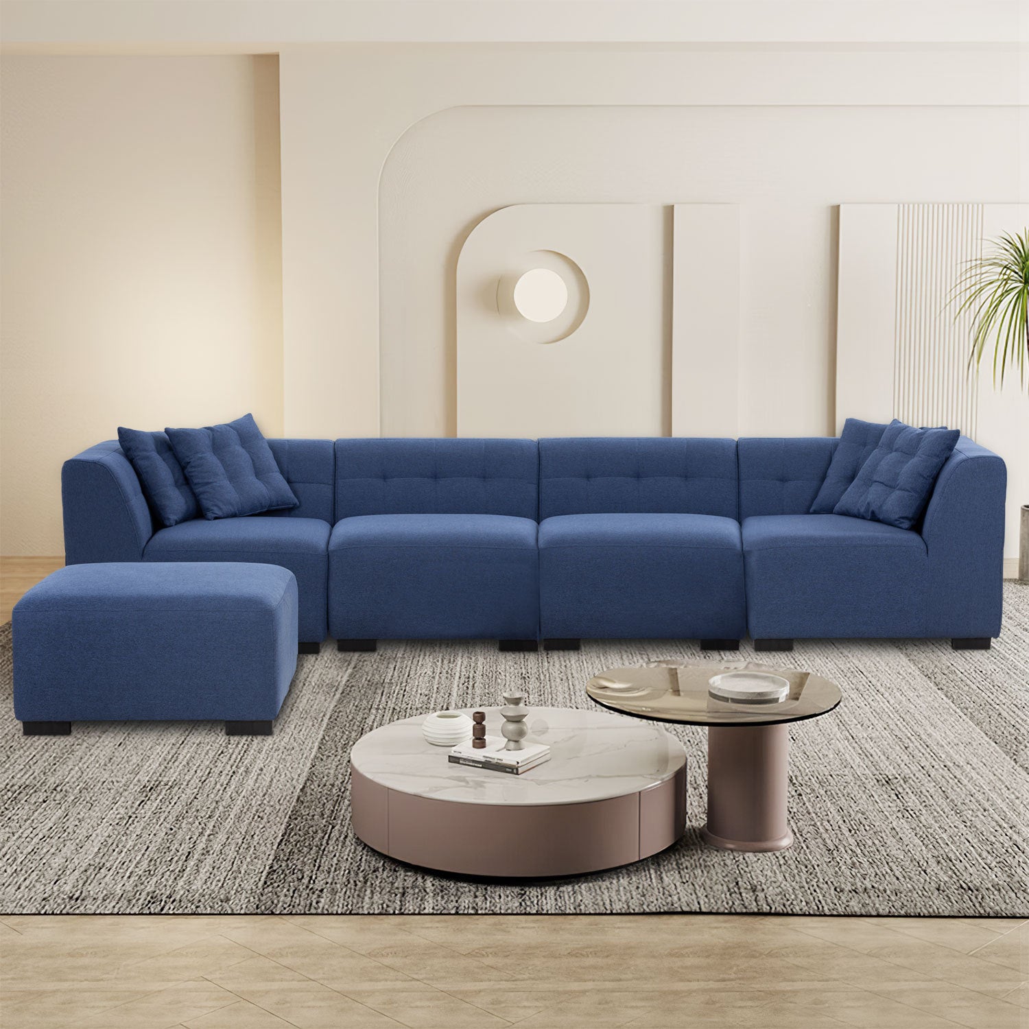 A stylish dark blue sectional sofa with an ottoman, showcasing a modern design and comfortable seating, perfect for living rooms.