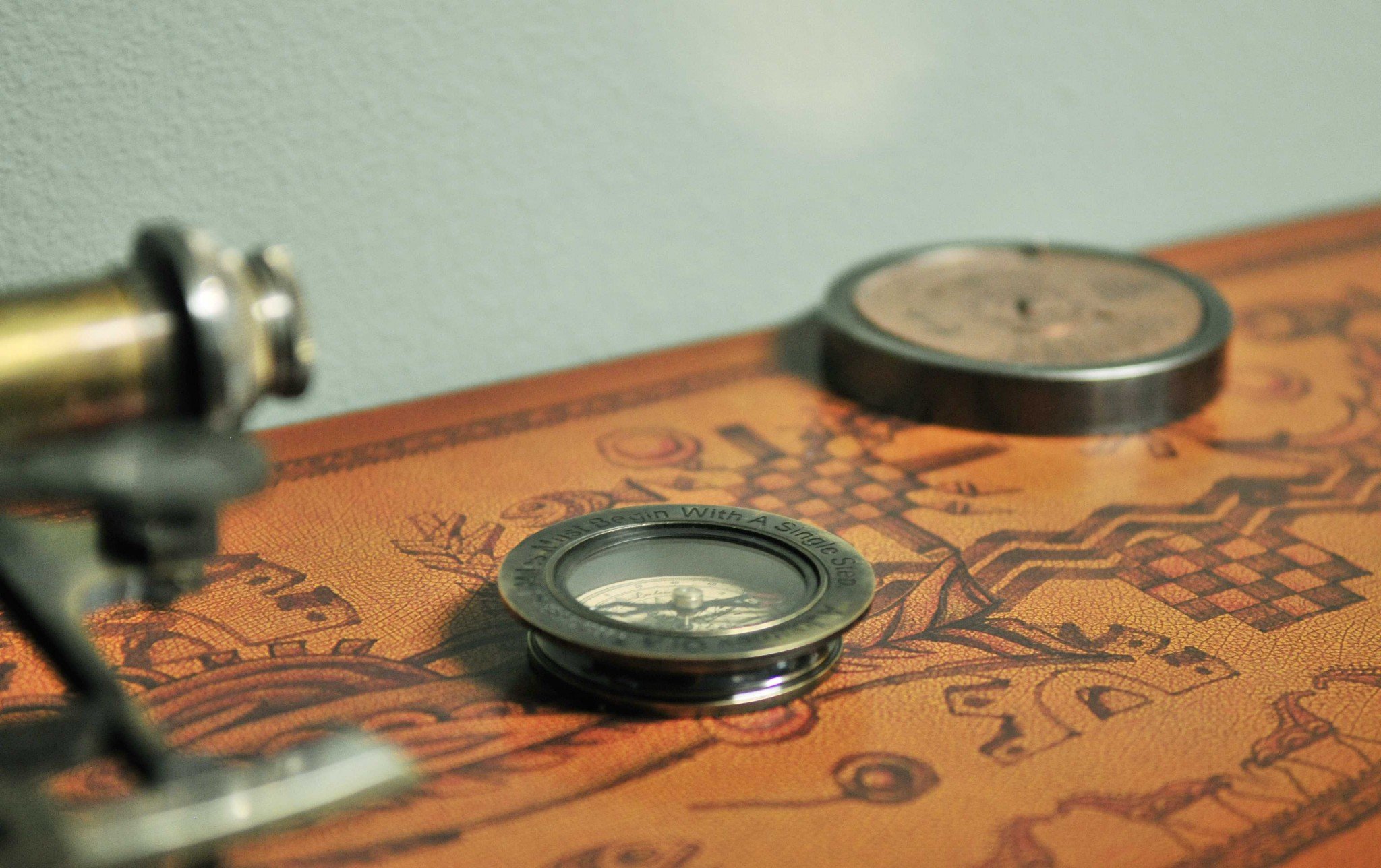 Set of 2 elegant pieces including a 100 Year Calendar with hand-carved details and a Compass Quote featuring an inspirational message, both in antique brass finish.