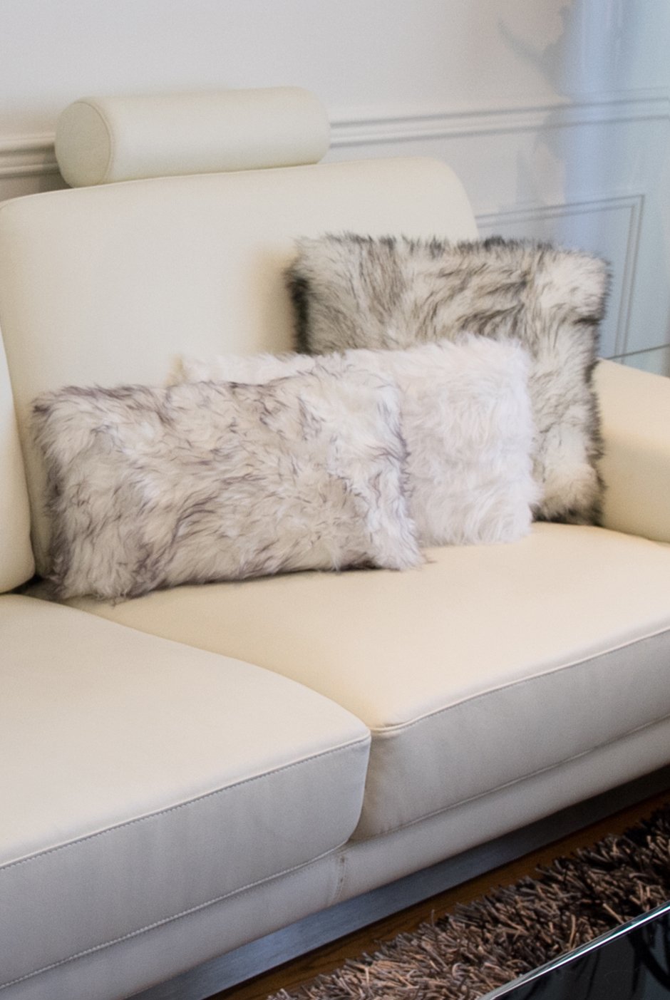 Set of 2 off white cozy faux fur lumbar pillows with plush texture, perfect for home decor and comfort.