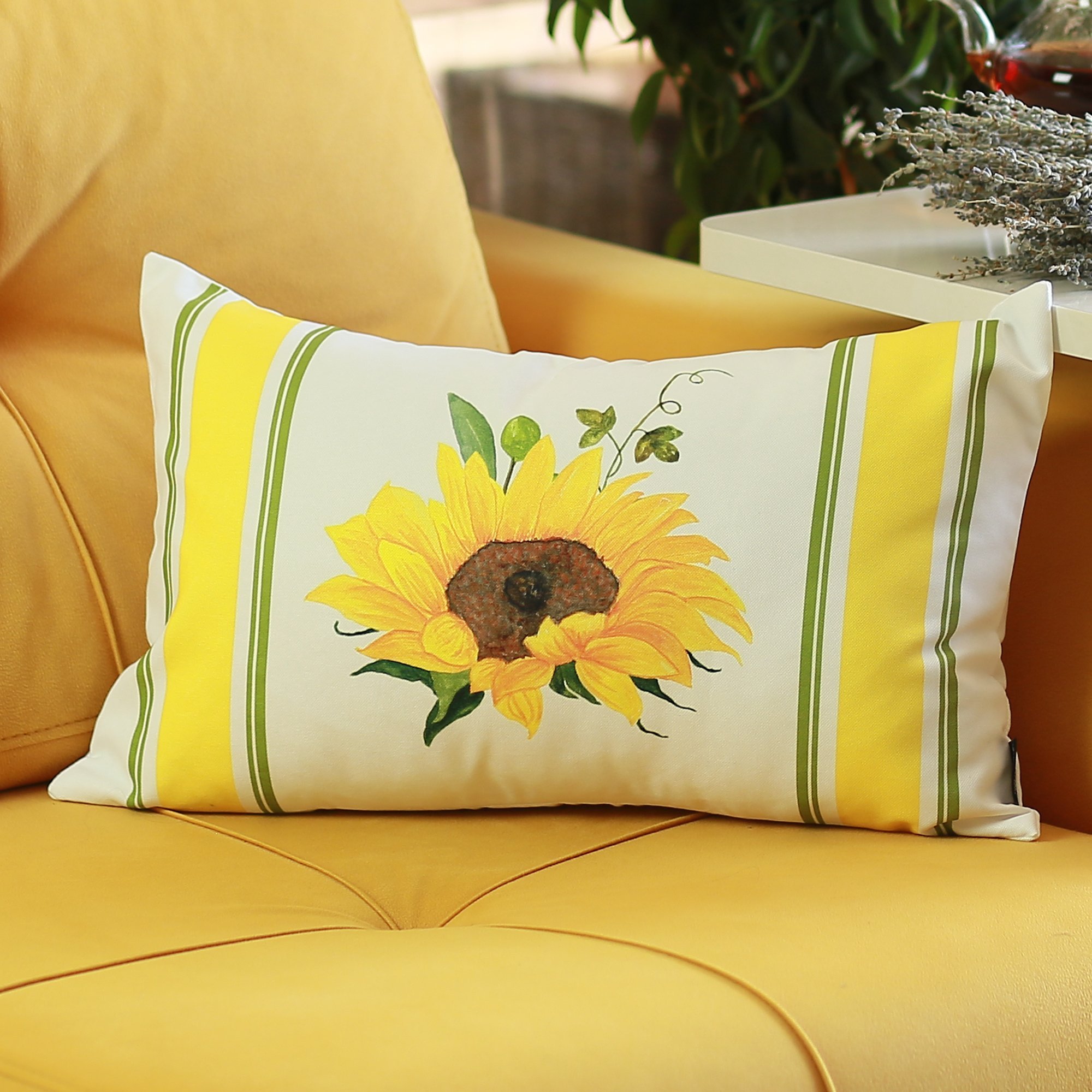 Set of 4 colorful sunflower design lumbar pillow covers on a sofa, showcasing vibrant yellow and green patterns.