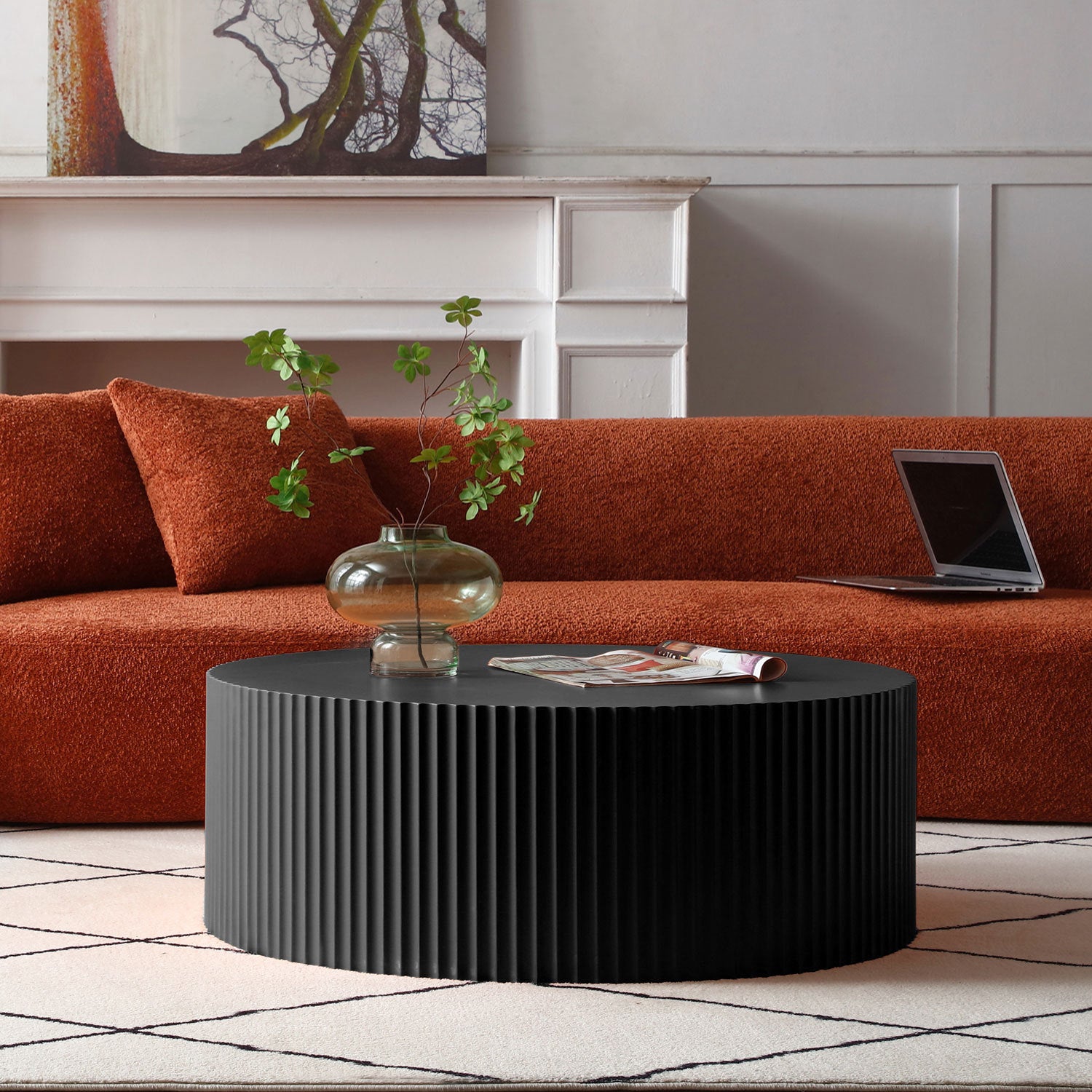 Sleek and modern round coffee table featuring an eye-catching relief design in matt black finish, perfect for contemporary living spaces.