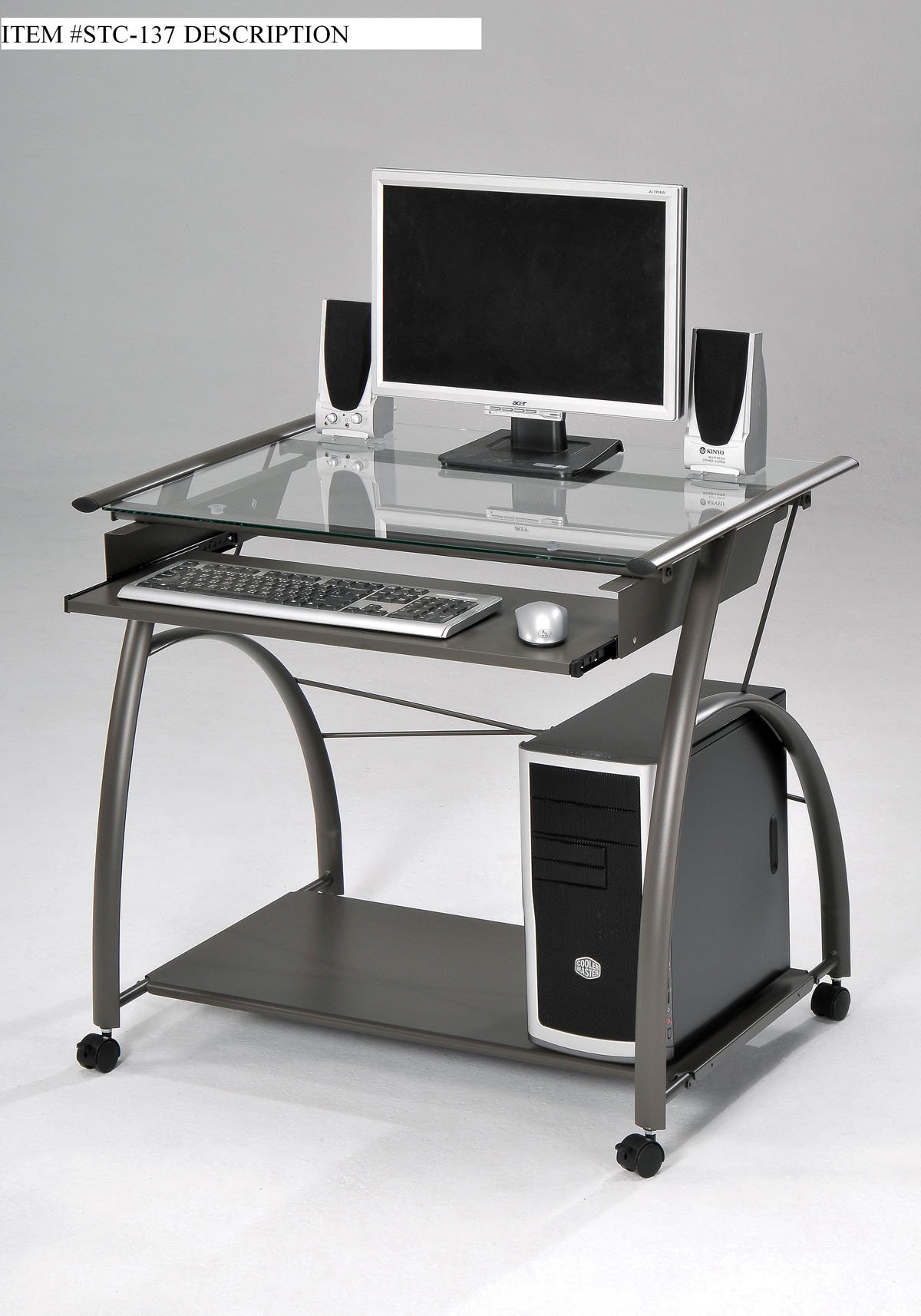 Sleek pewter and glass computer desk with a modern design, featuring a clear glass top and pull-out keyboard tray.